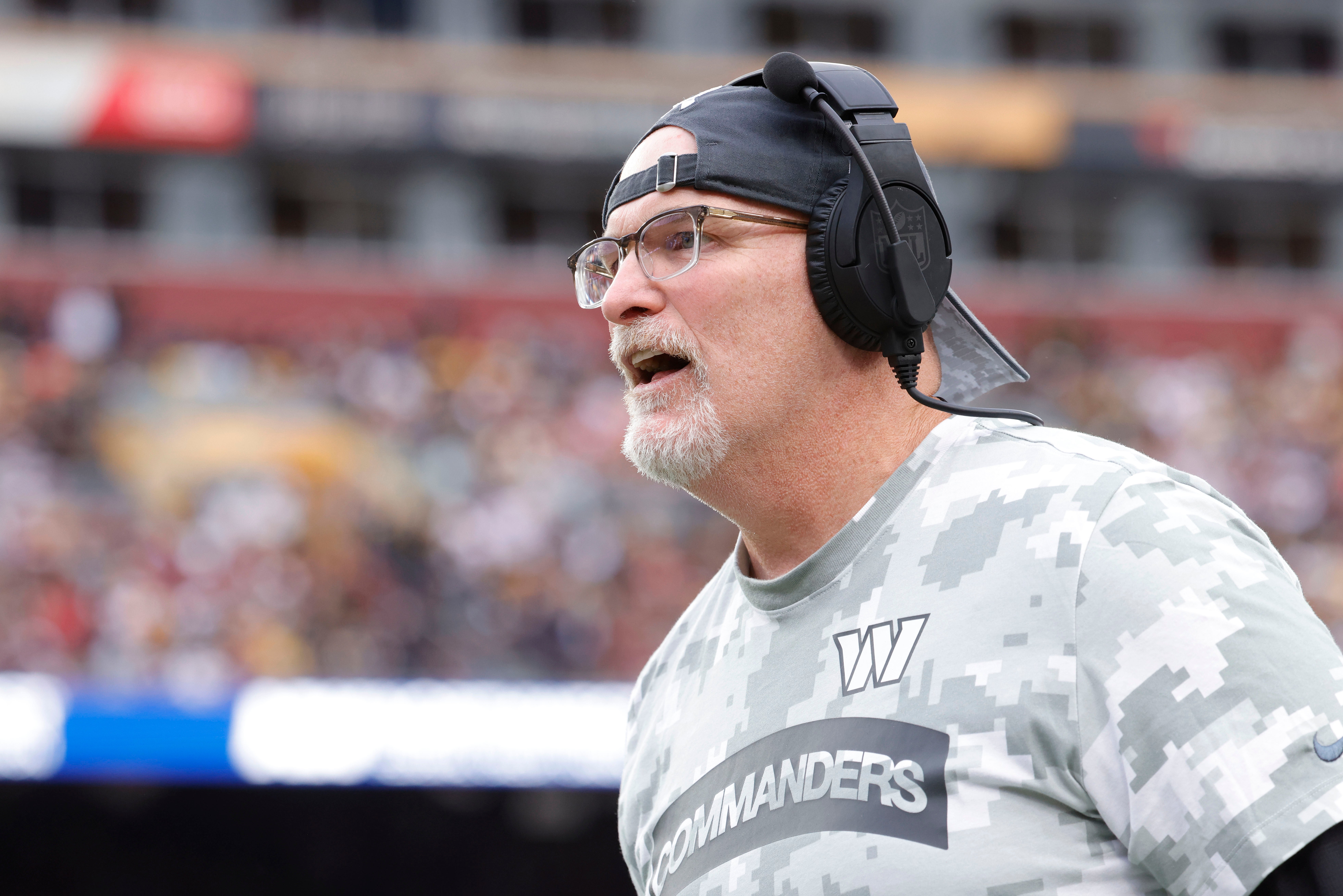 Washington Commanders head coach Dan Quinn looks on from the sidelines against the Pittsburgh Steelers during the second half at Northwest Stadium. Amber Searls-Imagn Images