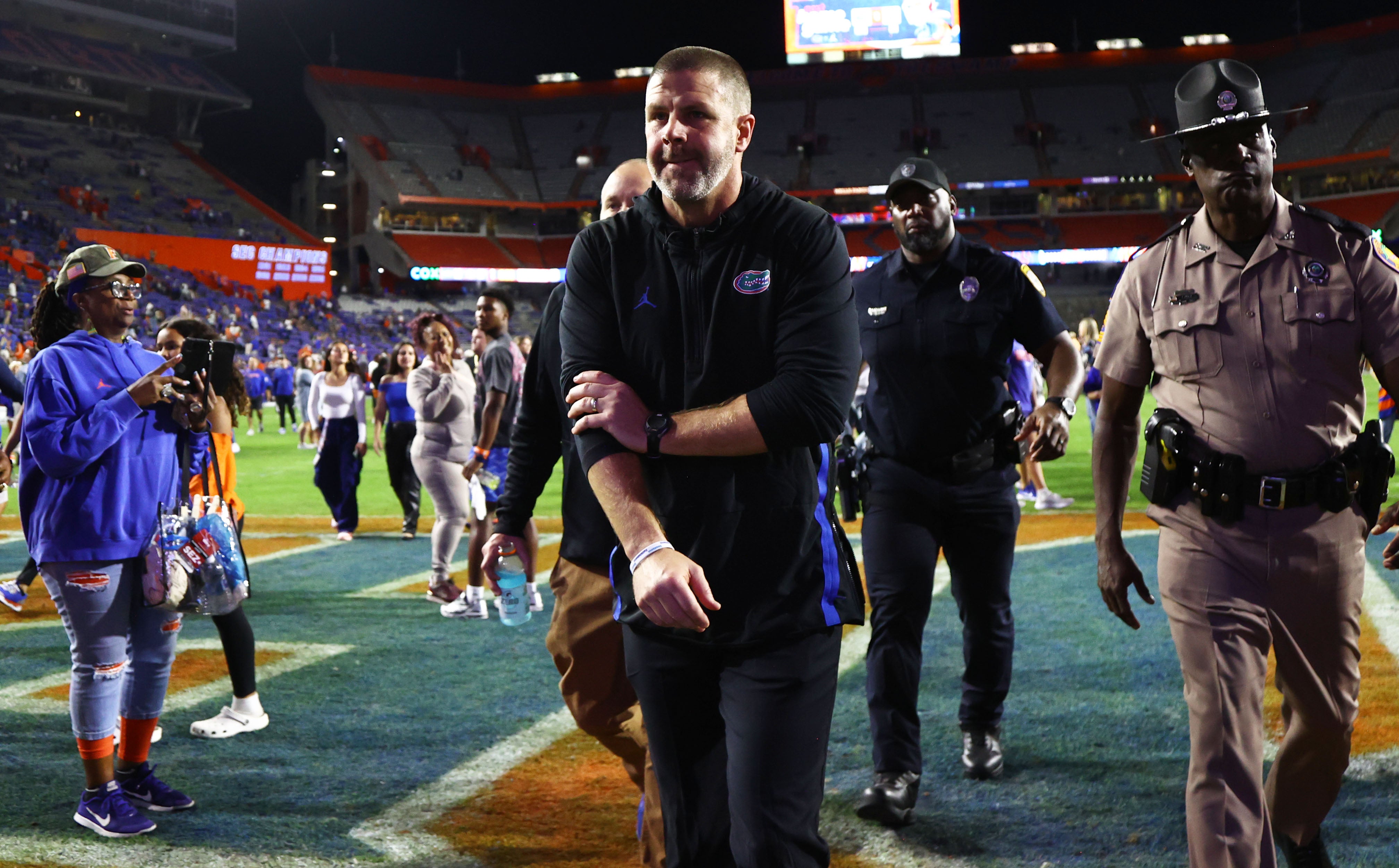 Nov 16, 2024; Gainesville, Florida, USA; Florida Gators head coach Billy Napier walks off the field after they beat the LSU Tigers at Ben Hill Griffin Stadium.