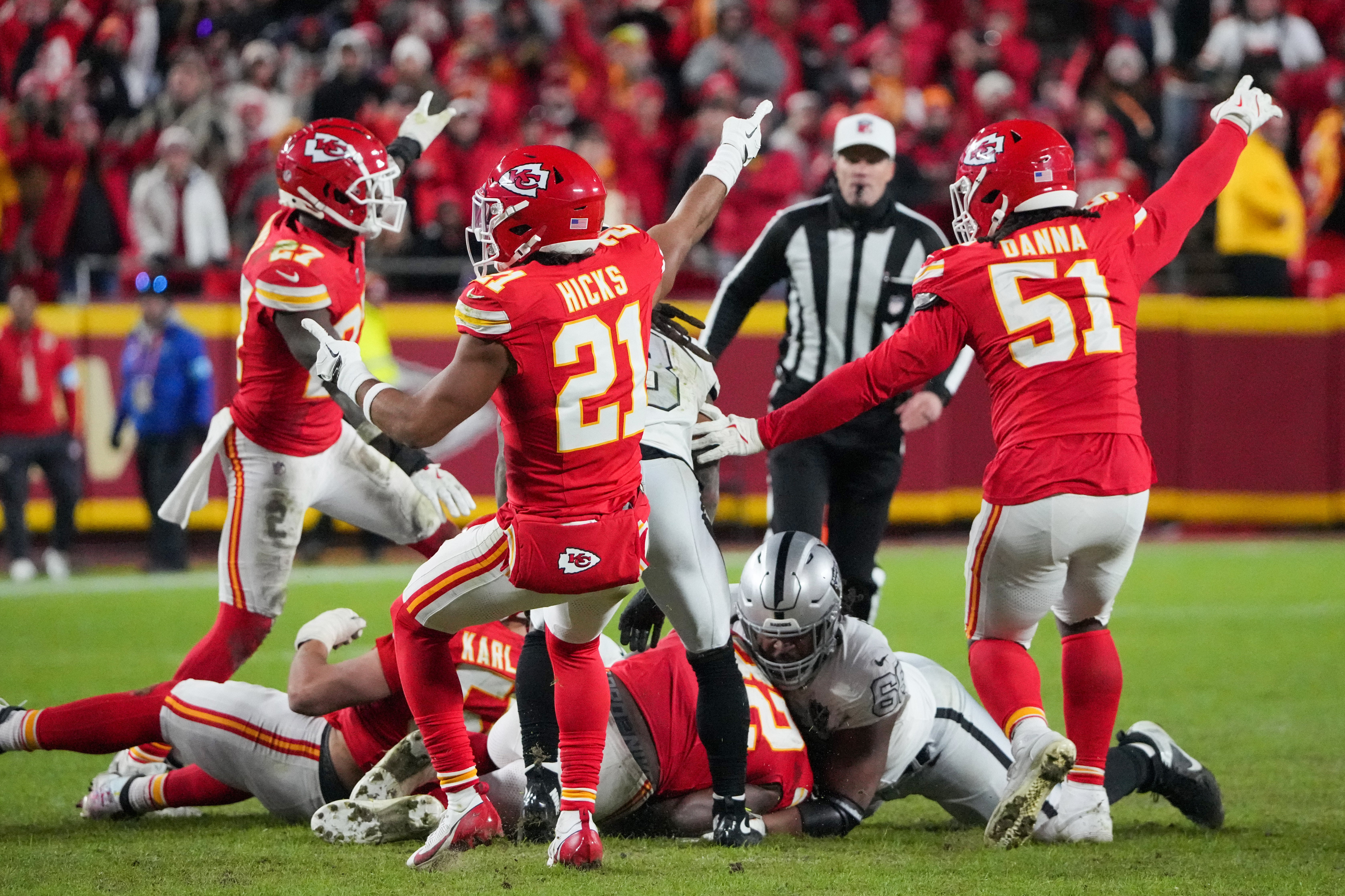 Nov 29, 2024; Kansas City, Missouri, USA; Kansas City Chiefs recover a fumbled snap during the second half at GEHA Field at Arrowhead Stadium.