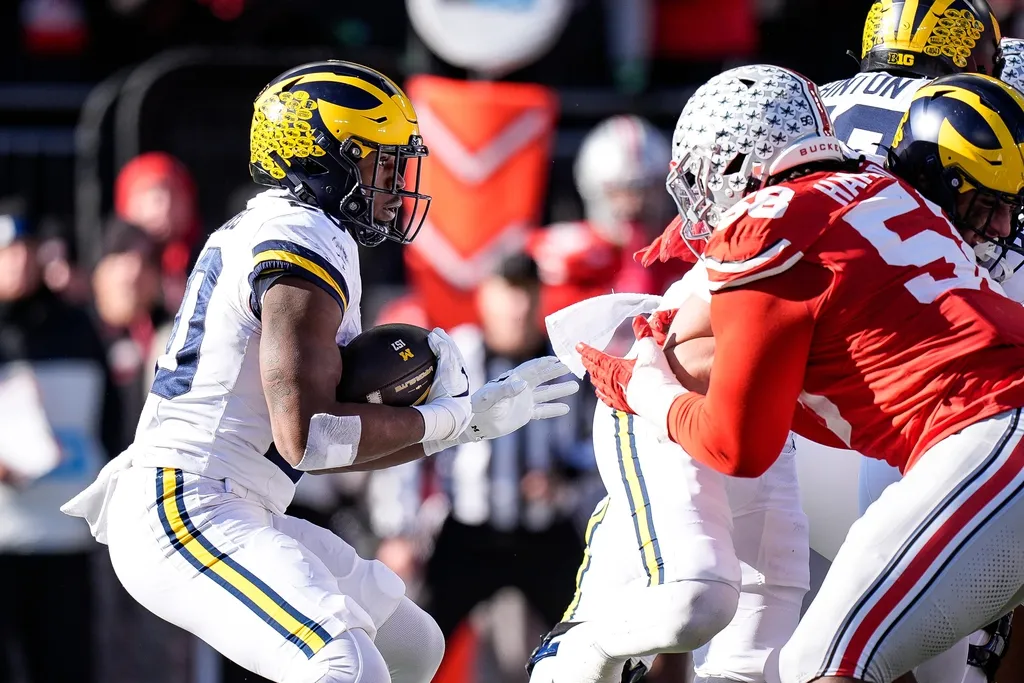 Michigan running back Kalel Mullings (20) runs against Ohio State during the first half at Ohio Stadium in Columbus, Ohio on Saturday, Nov. 30, 2024