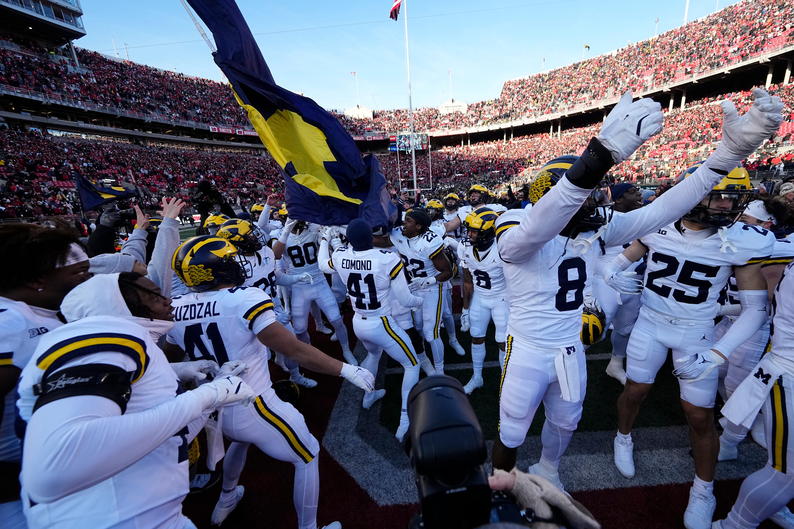 Michigan Wolverines celebrate following the NCAA football game against the Ohio State Buckeyes at Ohio Stadium in Columbus on Saturday, Nov. 30, 2024. Michigan won 13-10.