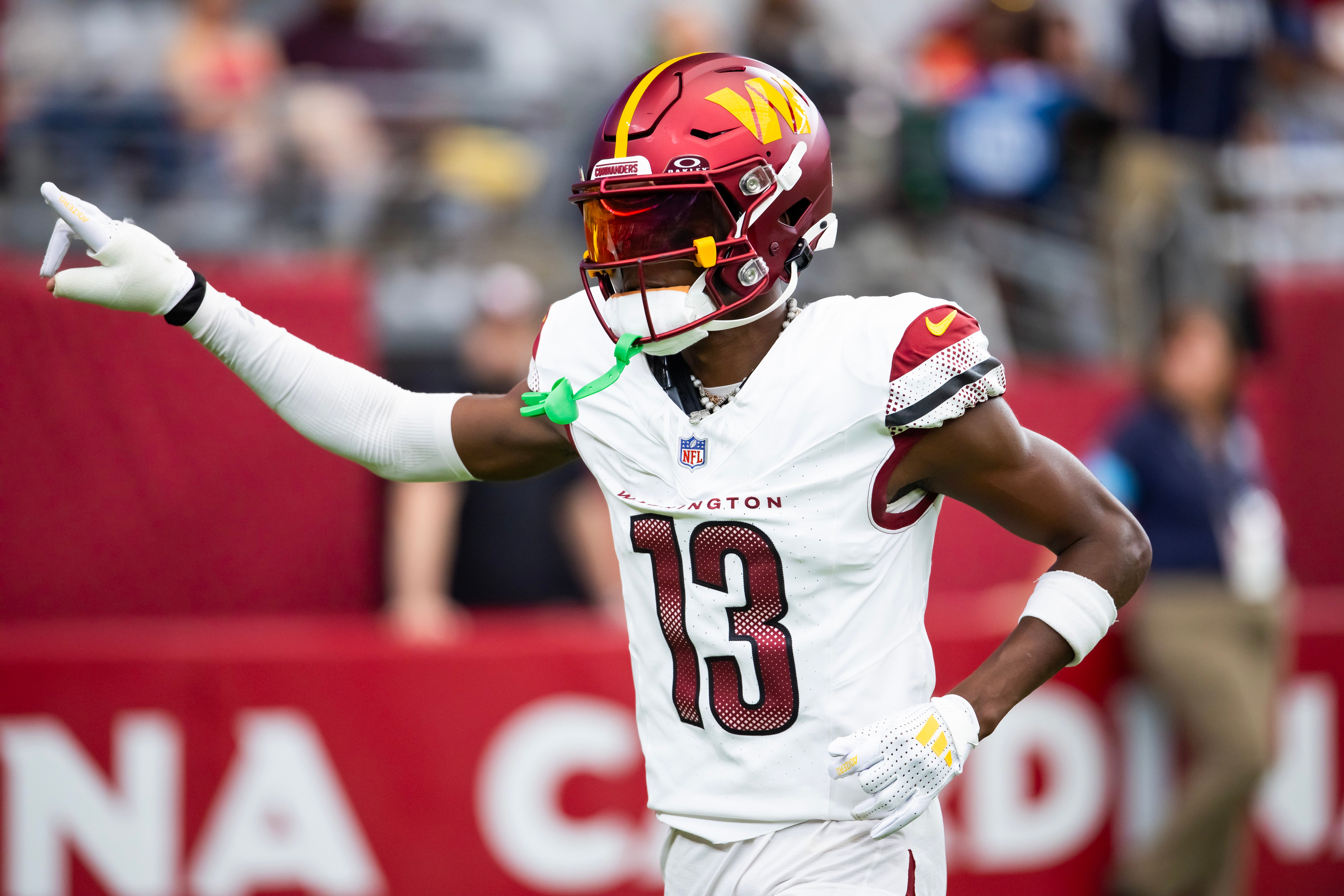 Sep 29, 2024; Glendale, Arizona, USA; Washington Commanders cornerback Emmanuel Forbes Jr. (13) against the Arizona Cardinals at State Farm Stadium.