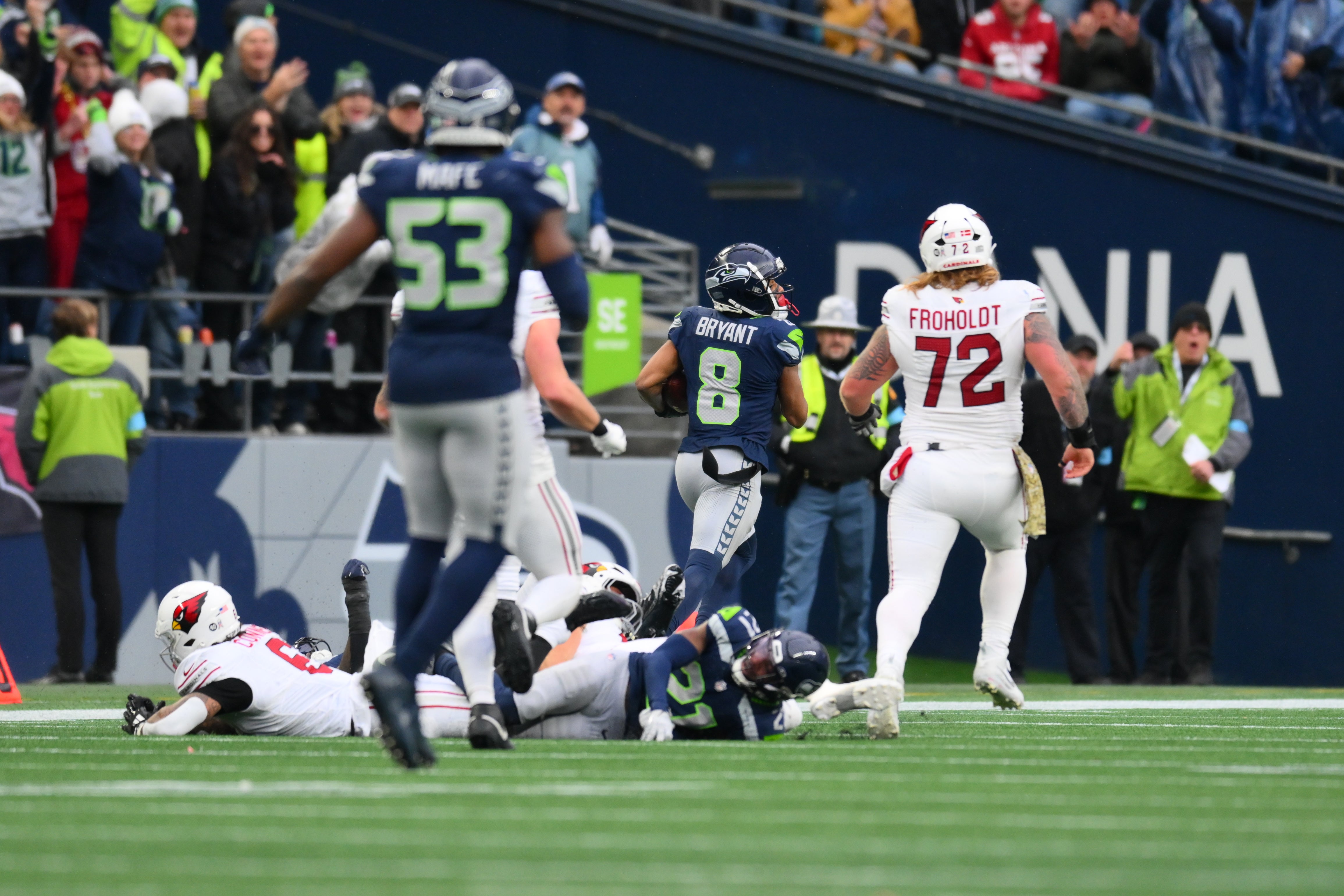 Seahawks cornerback Coby Bryant (8) returns an interception for a touchdown against the Cardinals.
