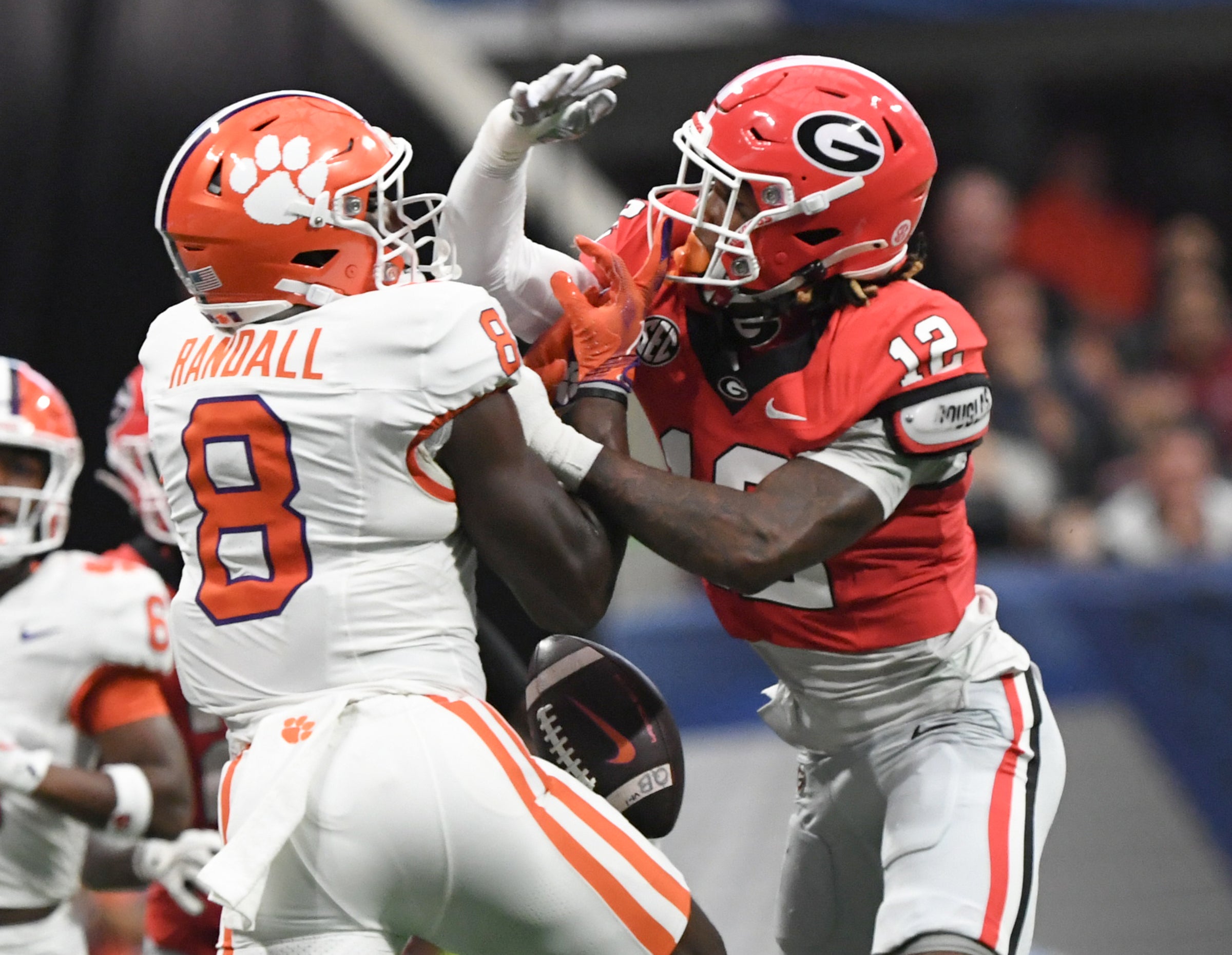 Georgia Bulldogs defensive back Julian Humphrey (12) breaks up a pass intended for Clemson Tigers wide receiver Adam Randall (8) during the second quarter of the 2024 Aflac Kickoff Game.