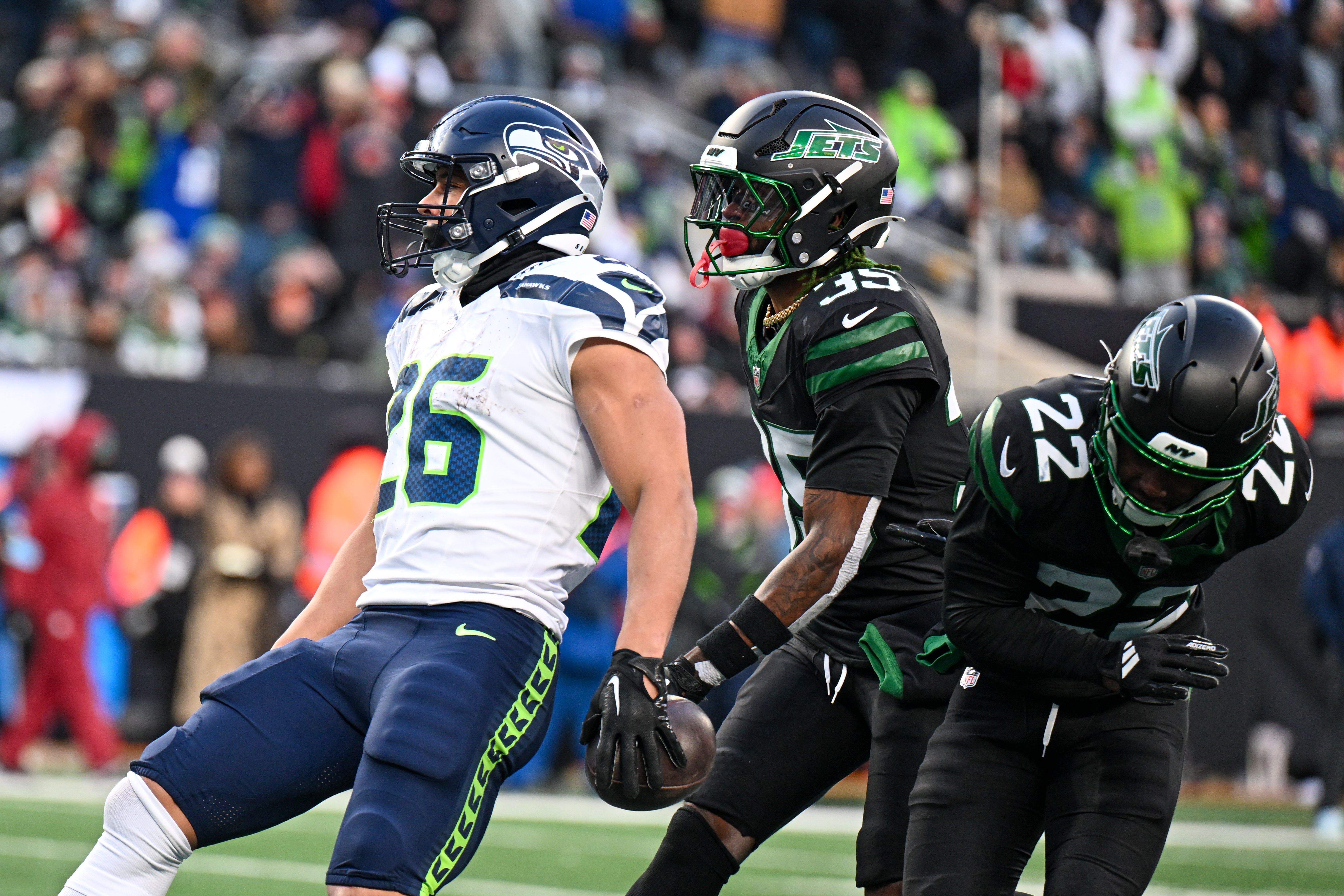 Seattle Seahawks running back Zach Charbonnet (26) celebrates scoring a touchdown during the fourth quarter against the New York Jets at MetLife Stadium.