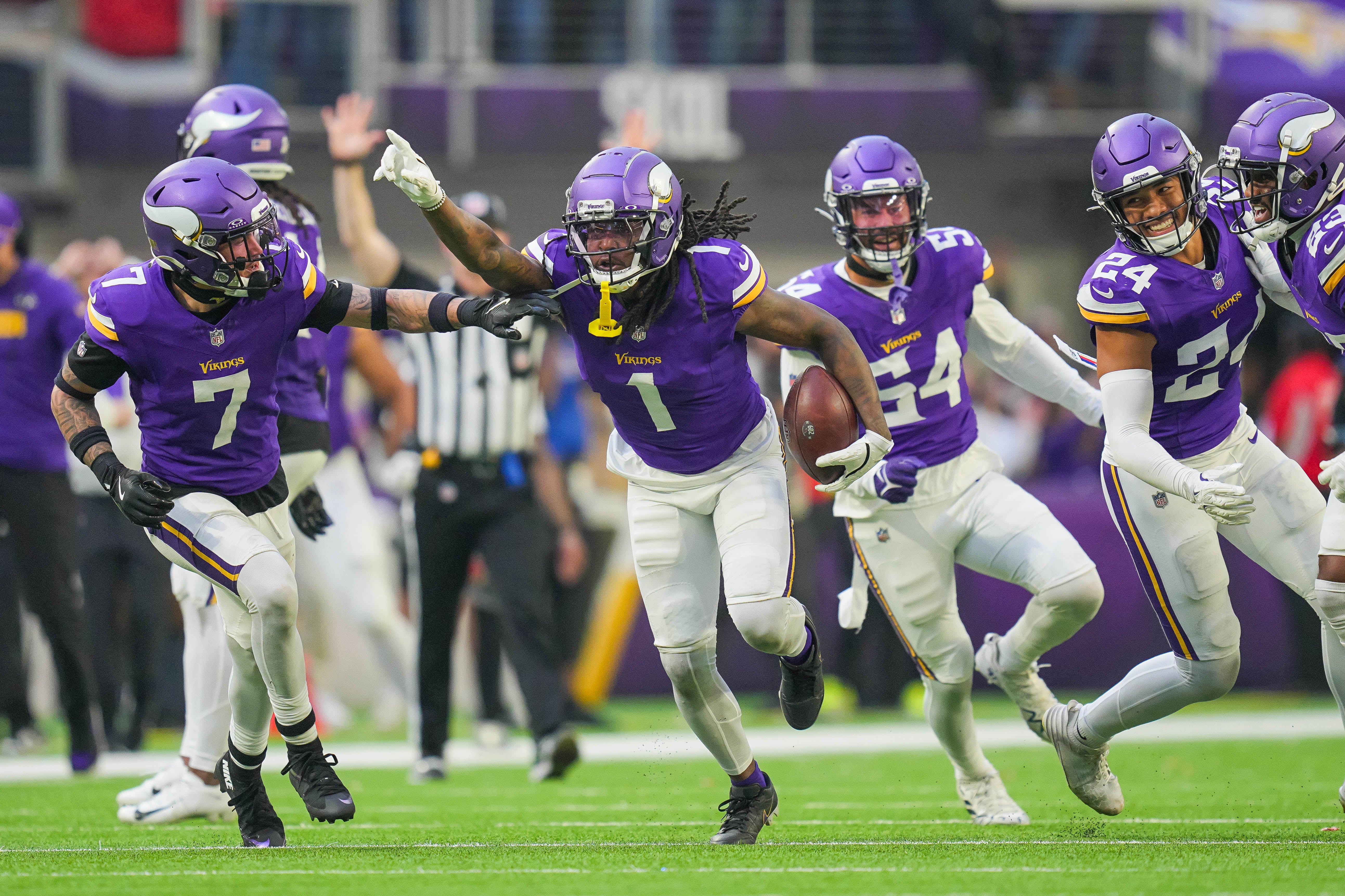 Dec 1, 2024; Minneapolis, Minnesota, USA; Minnesota Vikings cornerback Shaquill Griffin (1) celebrates his interception against the Arizona Cardinals in the fourth quarter at U.S. Bank Stadium.