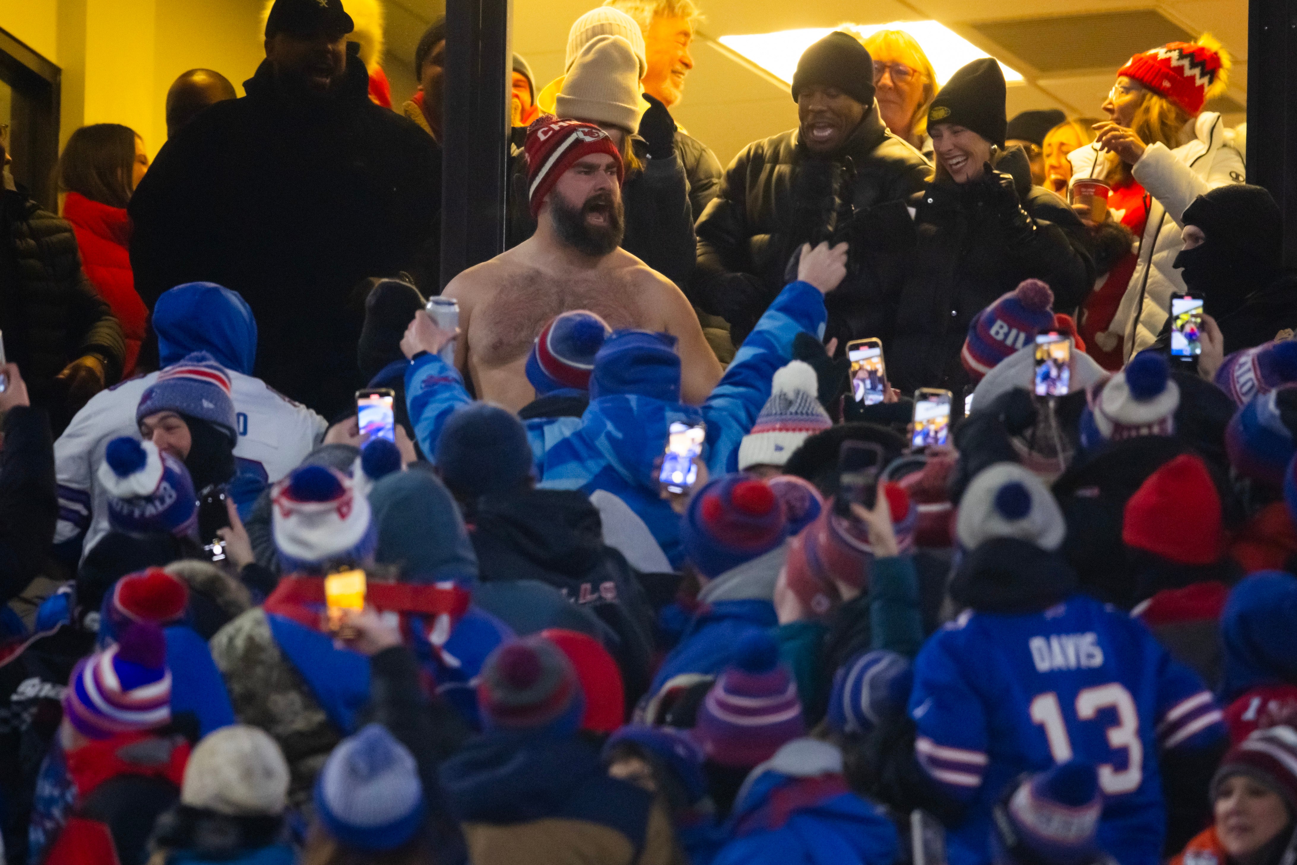 Jan 21, 2024; Orchard Park, New York, USA; Jason Kelce celebrates in the crowd after the Kansas City Chiefs score against the Buffalo Bills during the first half for the 2024 AFC divisional round game at Highmark Stadium.