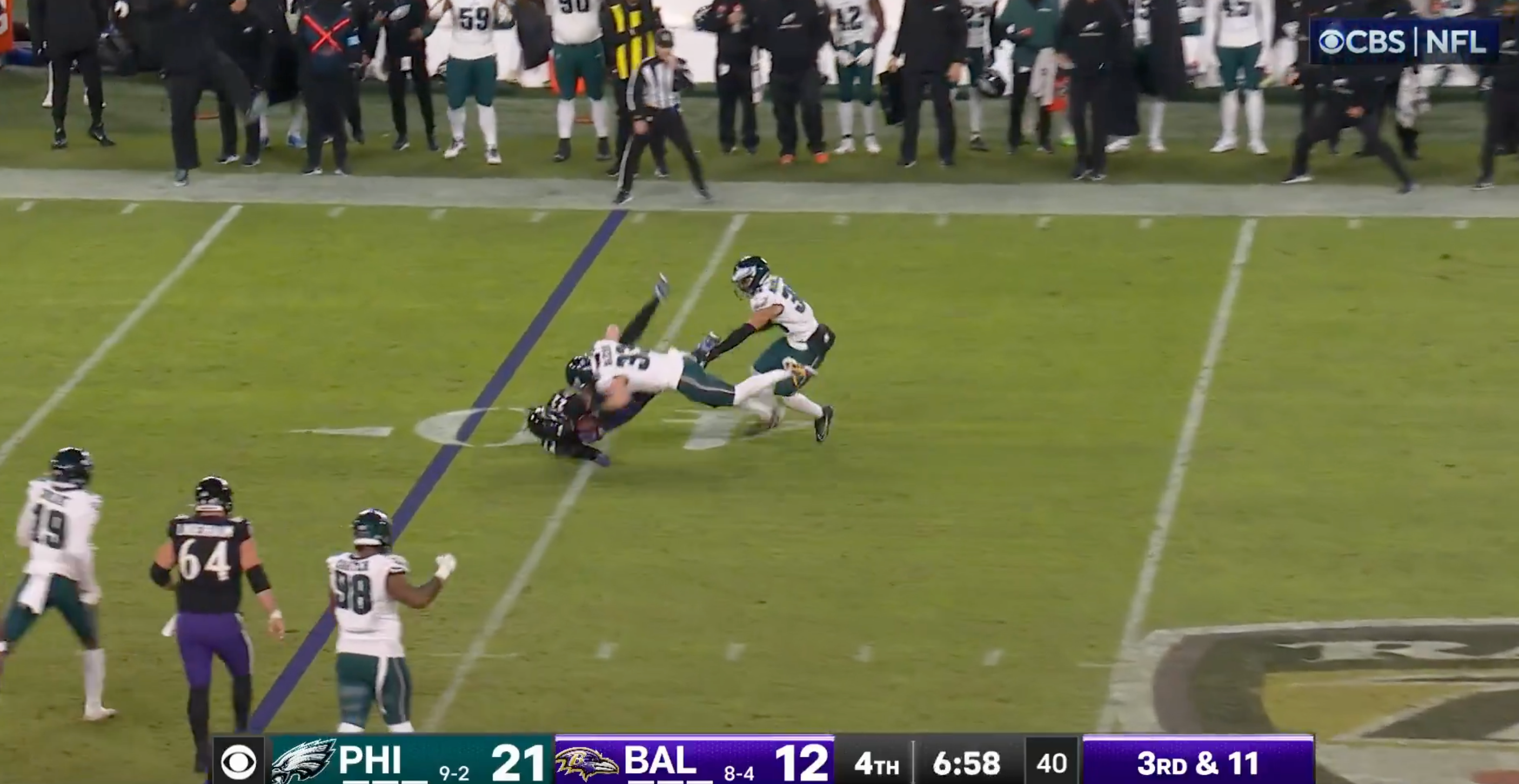 Philadelphia Eagles rookie Cooper DeJean tackles Derrick Henry in Week 13 win over Baltimore Ravens.