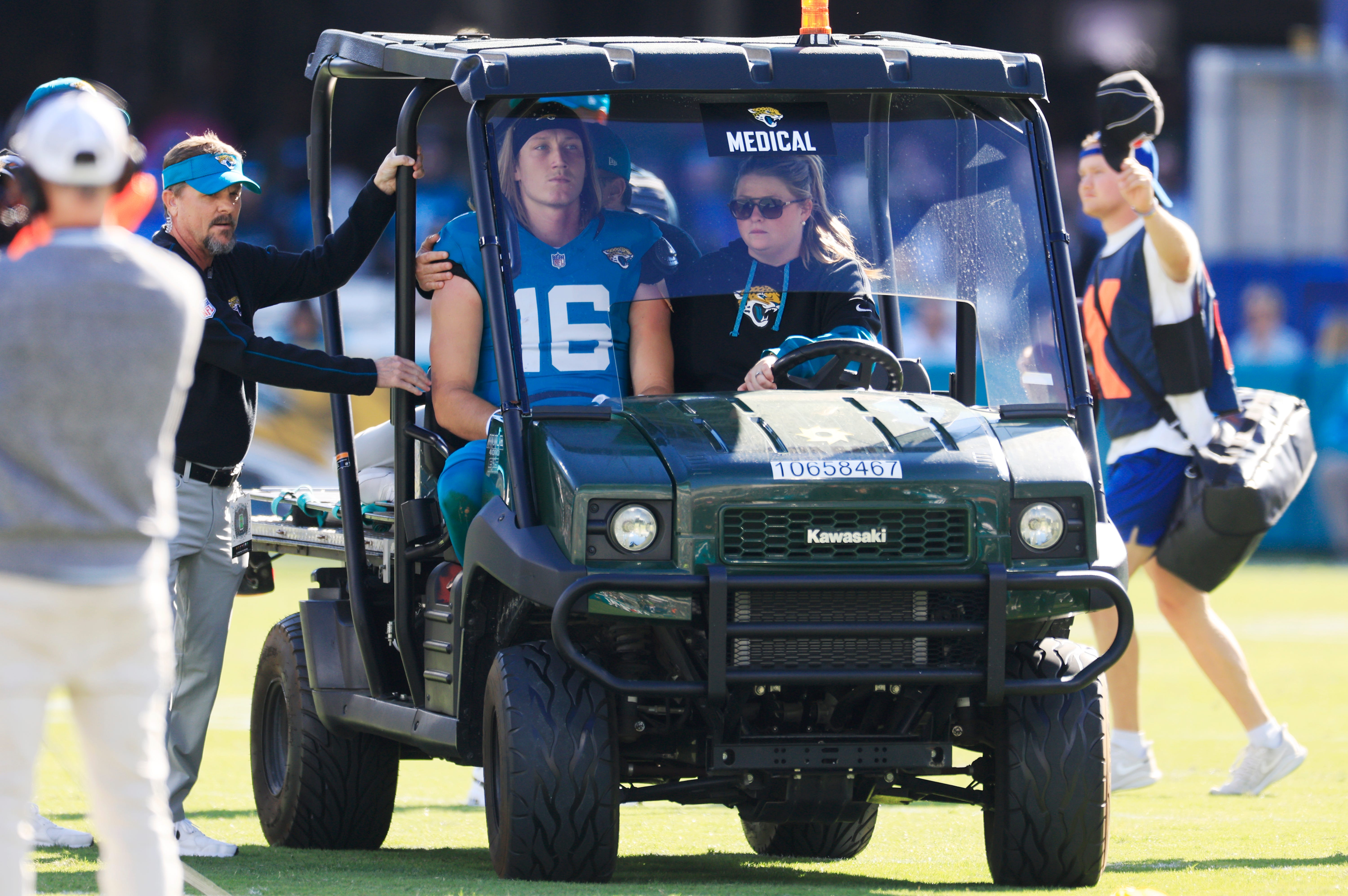 Jacksonville Jaguars quarterback Trevor Lawrence (16) is carted off the field after sustaining a heavy hit during the second quarter of an NFL football matchup Sunday, Dec. 1, 2024 at EverBank Stadium in Jacksonville, Fla. [Corey Perrine/Florida Times-Union]