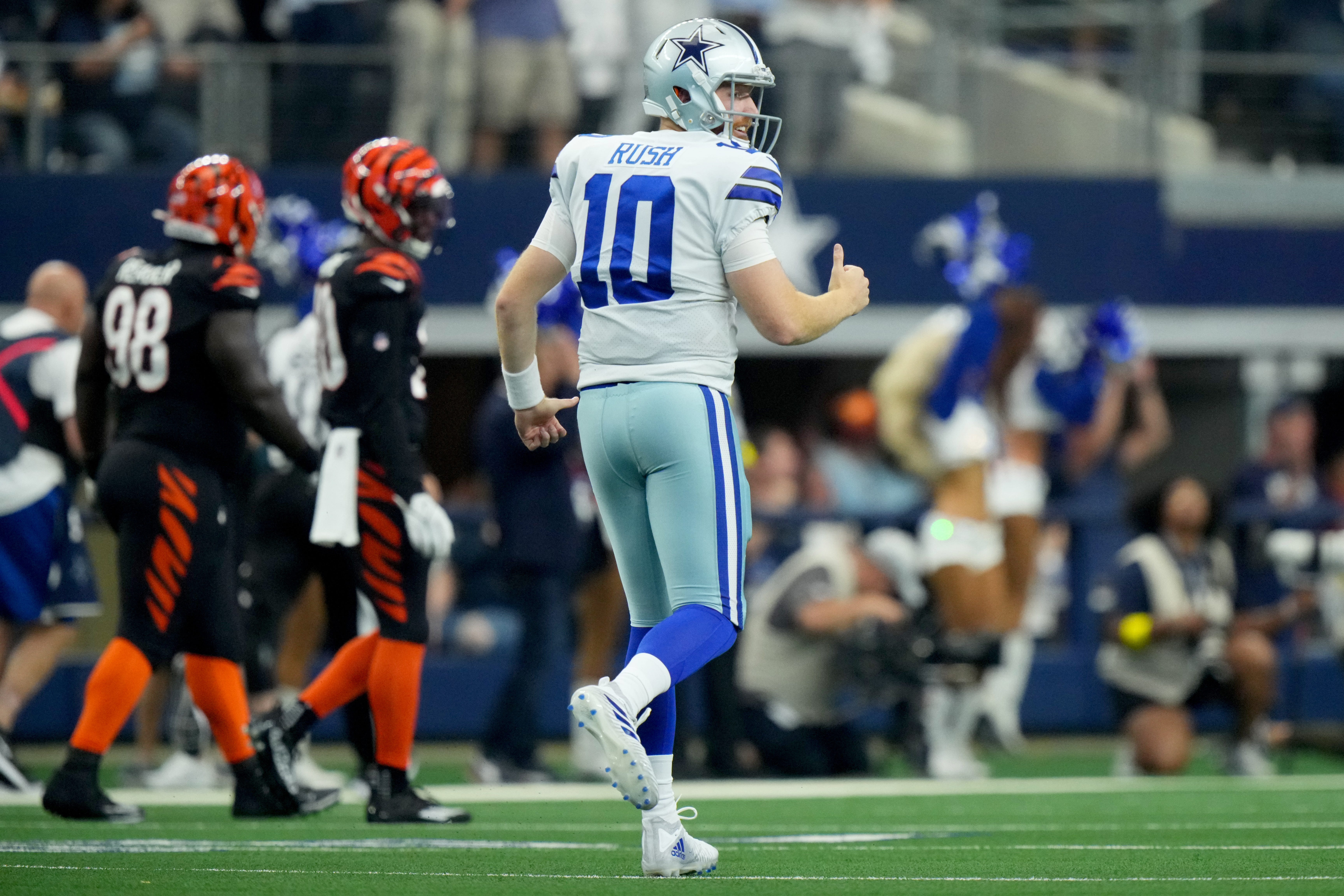 Dallas Cowboys quarterback Cooper Rush (10) looks toward the Cincinnati Bengals sideline after throwing a touchdown pass to Dallas Cowboys running back Tony Pollard (20) in the first quarter of an NFL Week 2 game against the Cincinnati Bengals