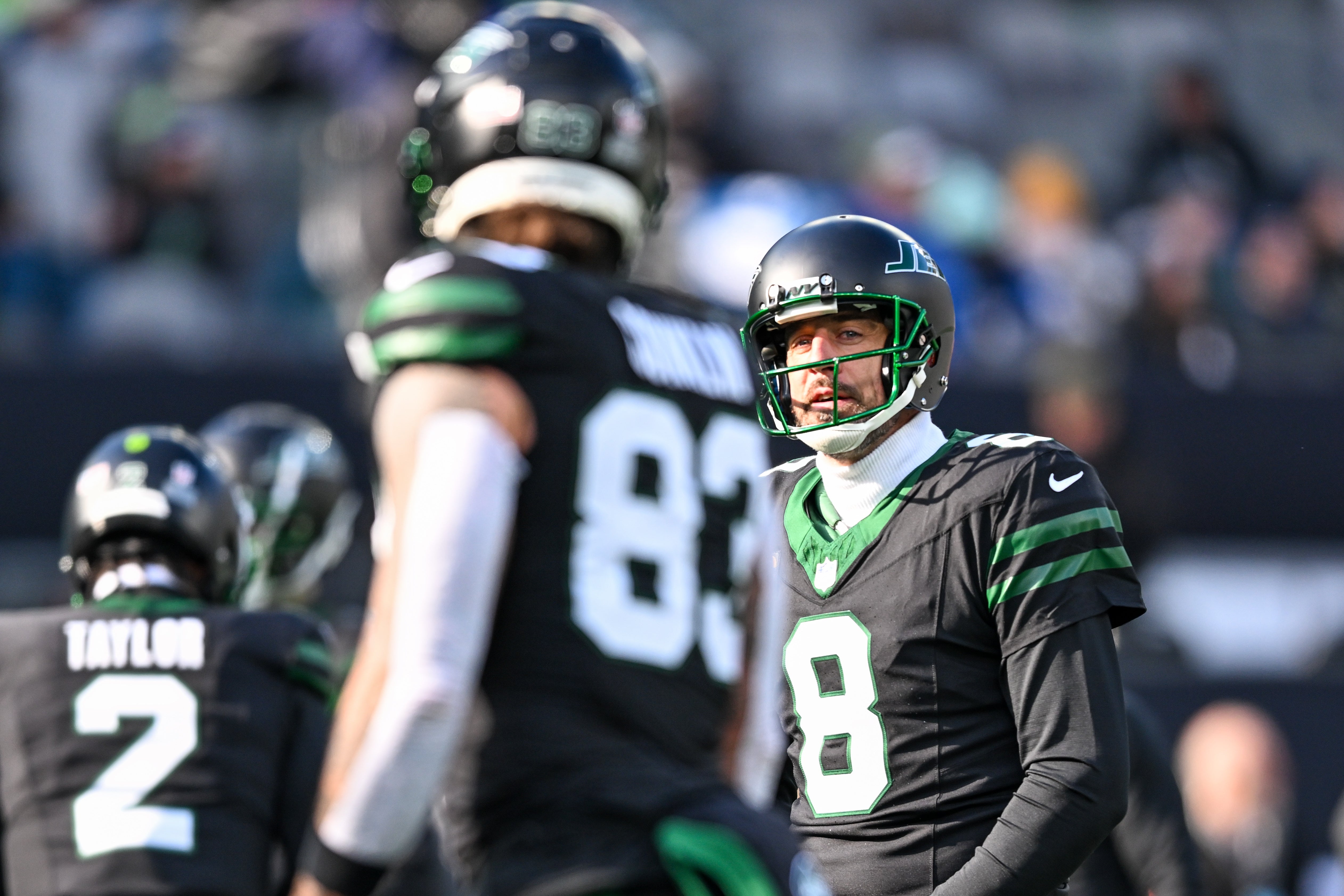 New York Jets quarterback Aaron Rodgers (8) warms up with tight end Tyler Conklin (83) before the game against the Seattle Seahawks at MetLife Stadium.