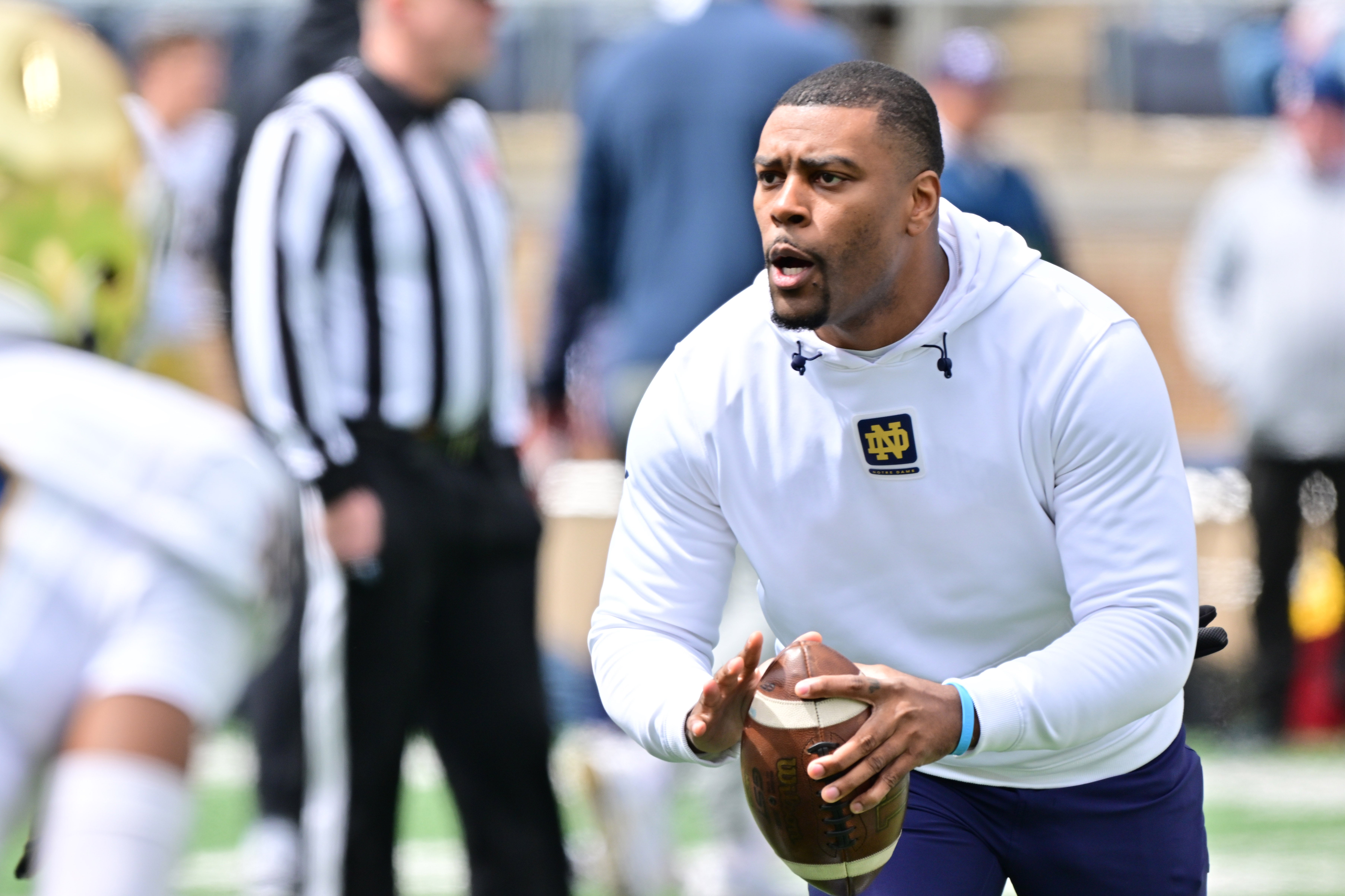 Notre Dame Fighting Irish defensive backs coach Mike Mickens participates in warmups before the Blue-Gold Game at Notre Dame Stadium.