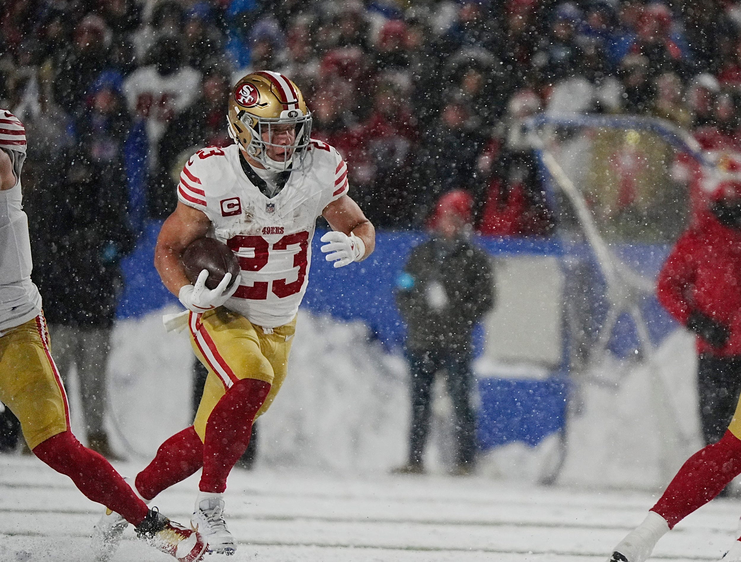 49ers Christian McCaffrey carries the ball for several yards during first half action of their home game against the San Francisco 49ers in Orchard Park on Dec. 1, 2024.