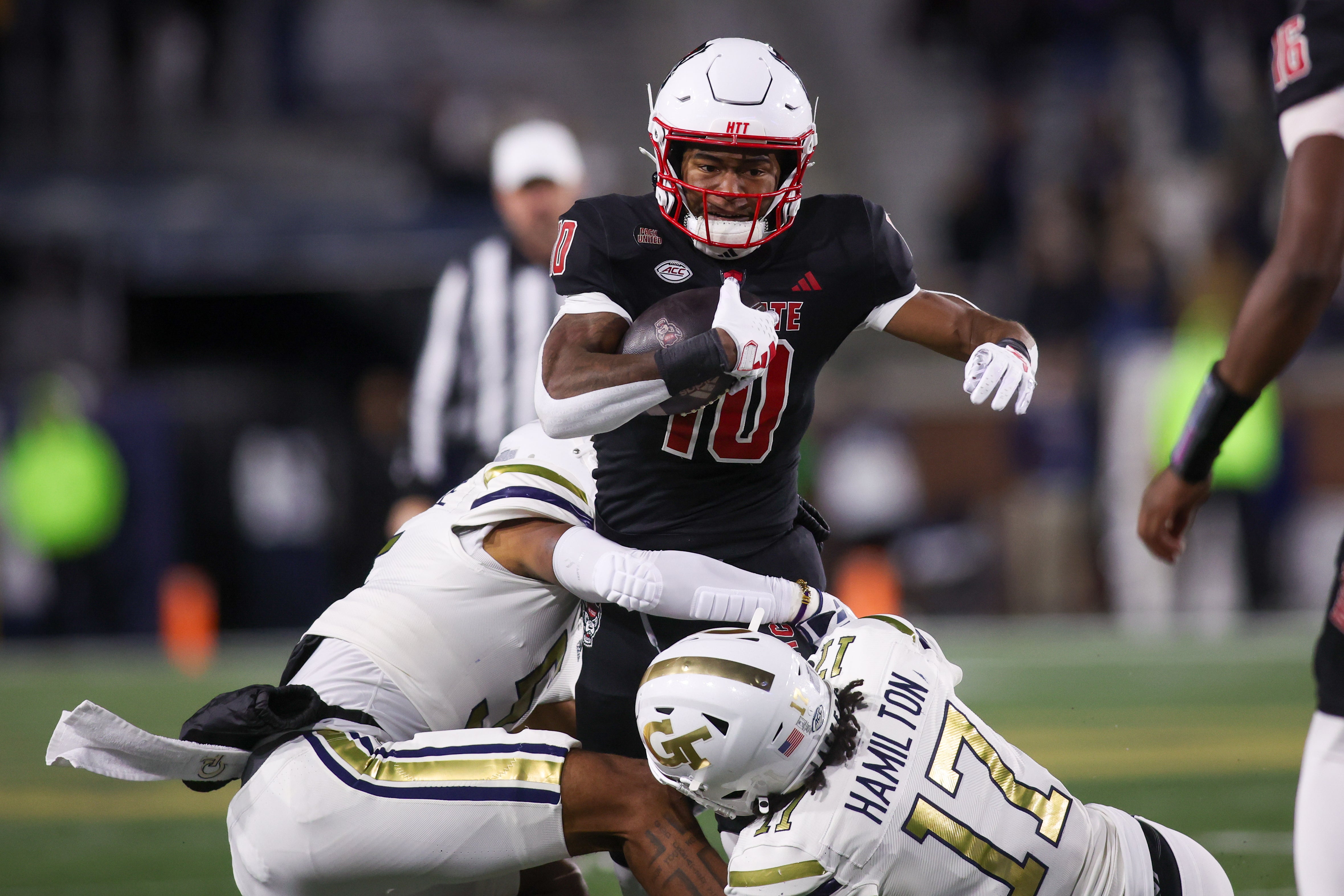 North Carolina State Wolfpack wide receiver Kevin Concepcion (10) runs the ball against the Georgia Tech Yellow Jackets in the first quarter at Bobby Dodd Stadium at Hyundai Field.
