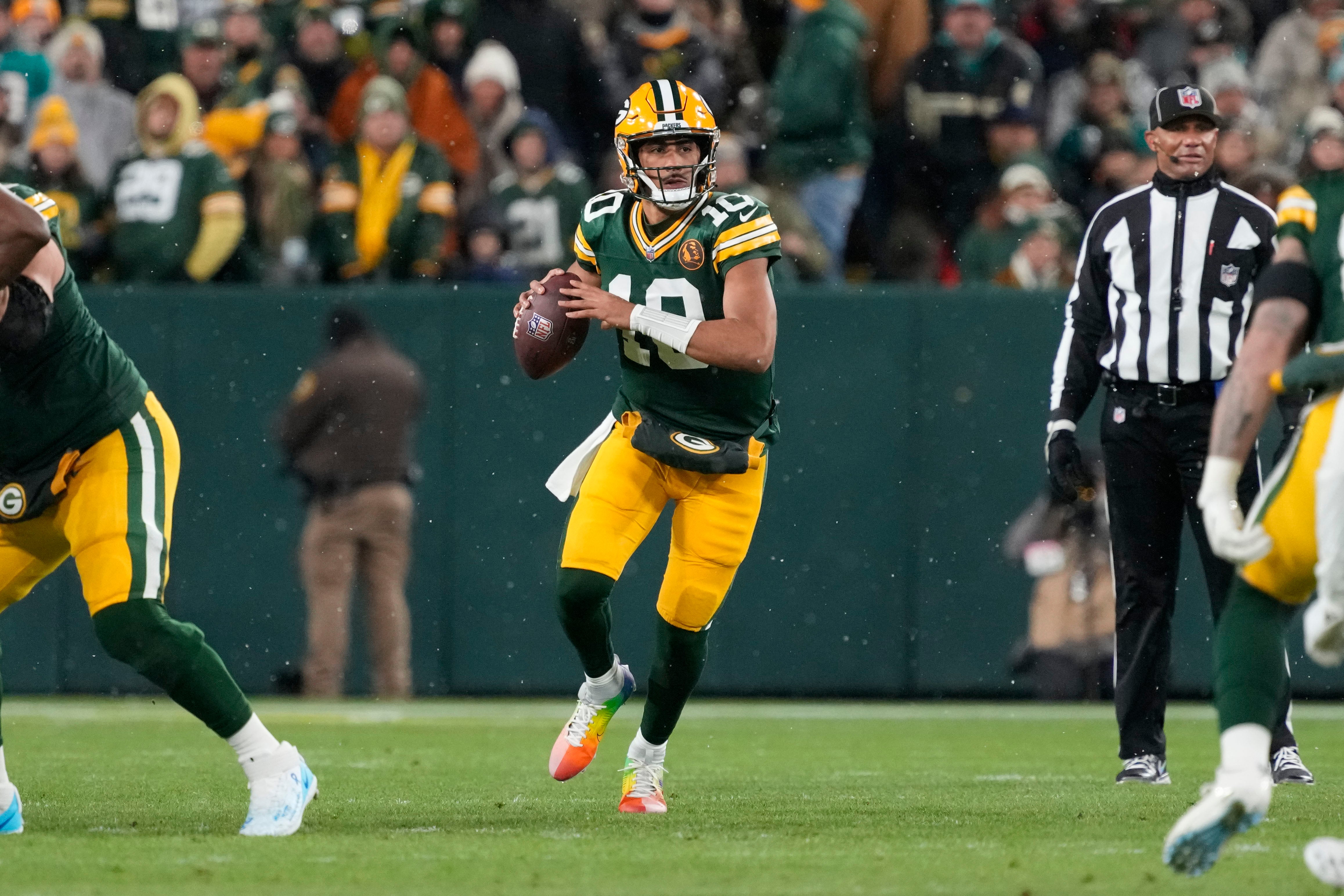 Nov 28, 2024; Green Bay, Wisconsin, USA; Green Bay Packers quarterback Jordan Love (10) looks to throw a pass during the first quarter against the Miami Dolphins at Lambeau Field.