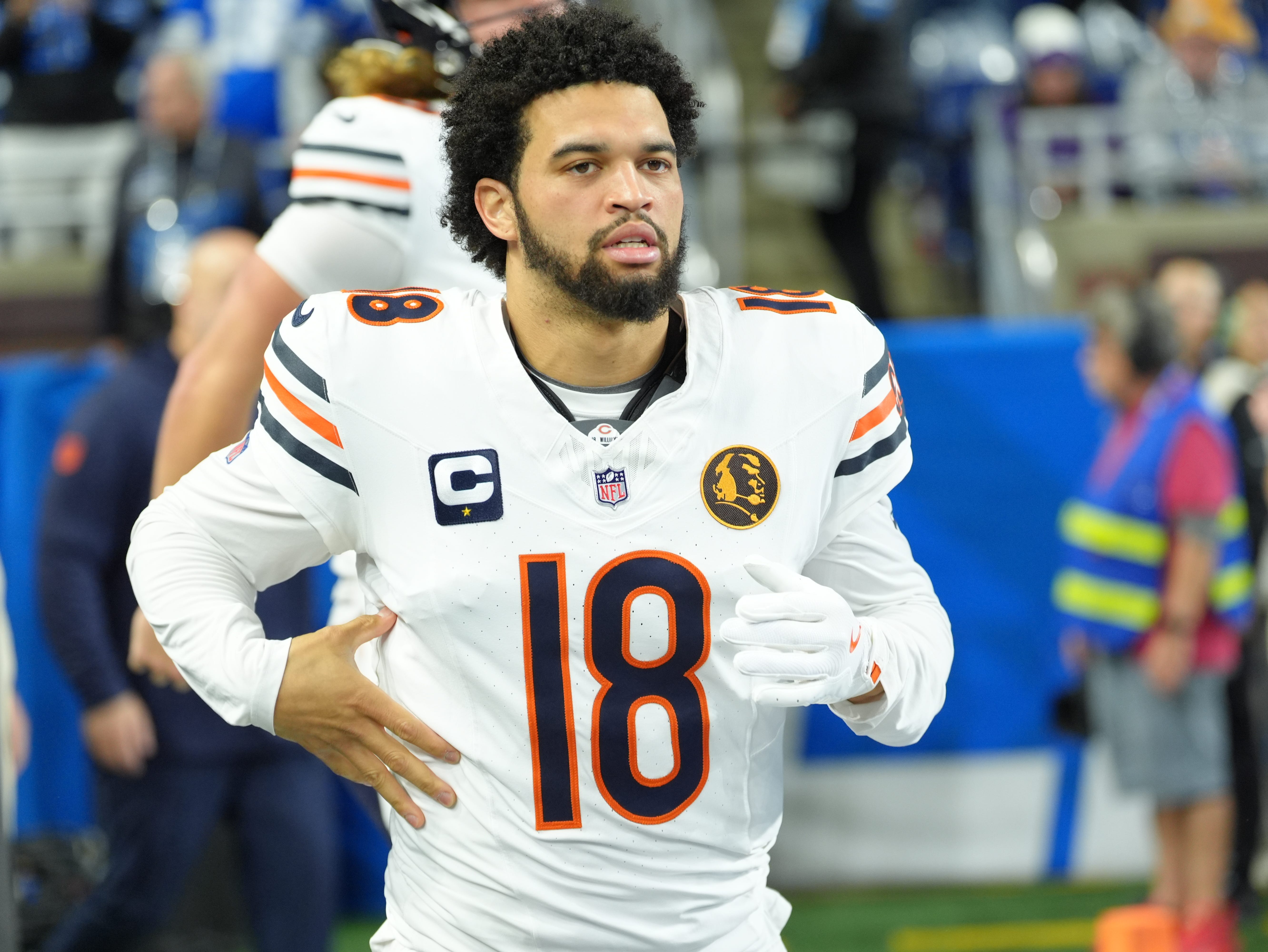 Chicago Bears quarterback Caleb Williams (18) runs onto the field to warm up on Thanksgiving Day at Ford Field in Detroit on Thursday, Nov. 28, 2024.