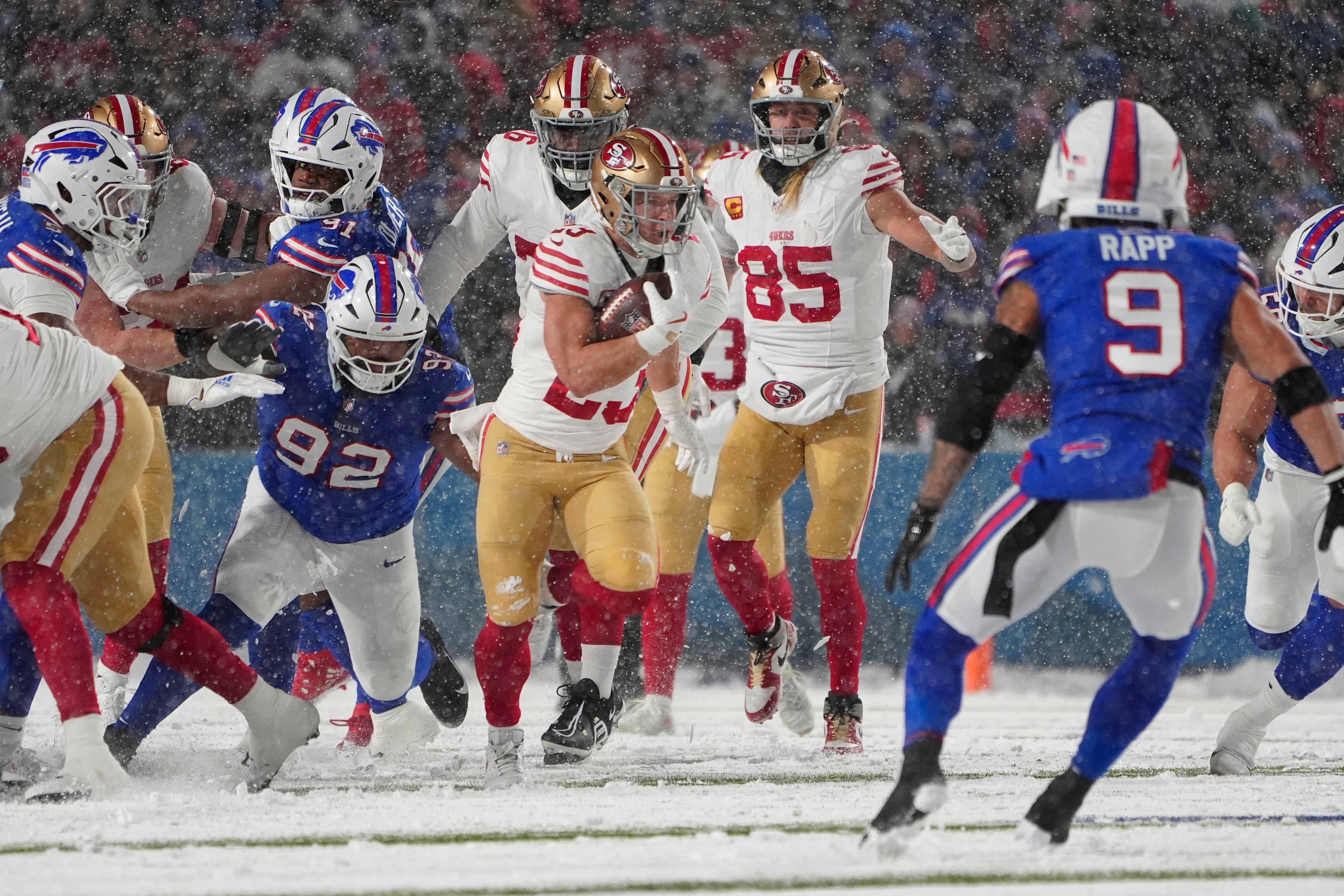 San Francisco 49ers running back Christian McCaffrey (23) runs with the ball against the Buffalo Bills during the first half at Highmark Stadium.