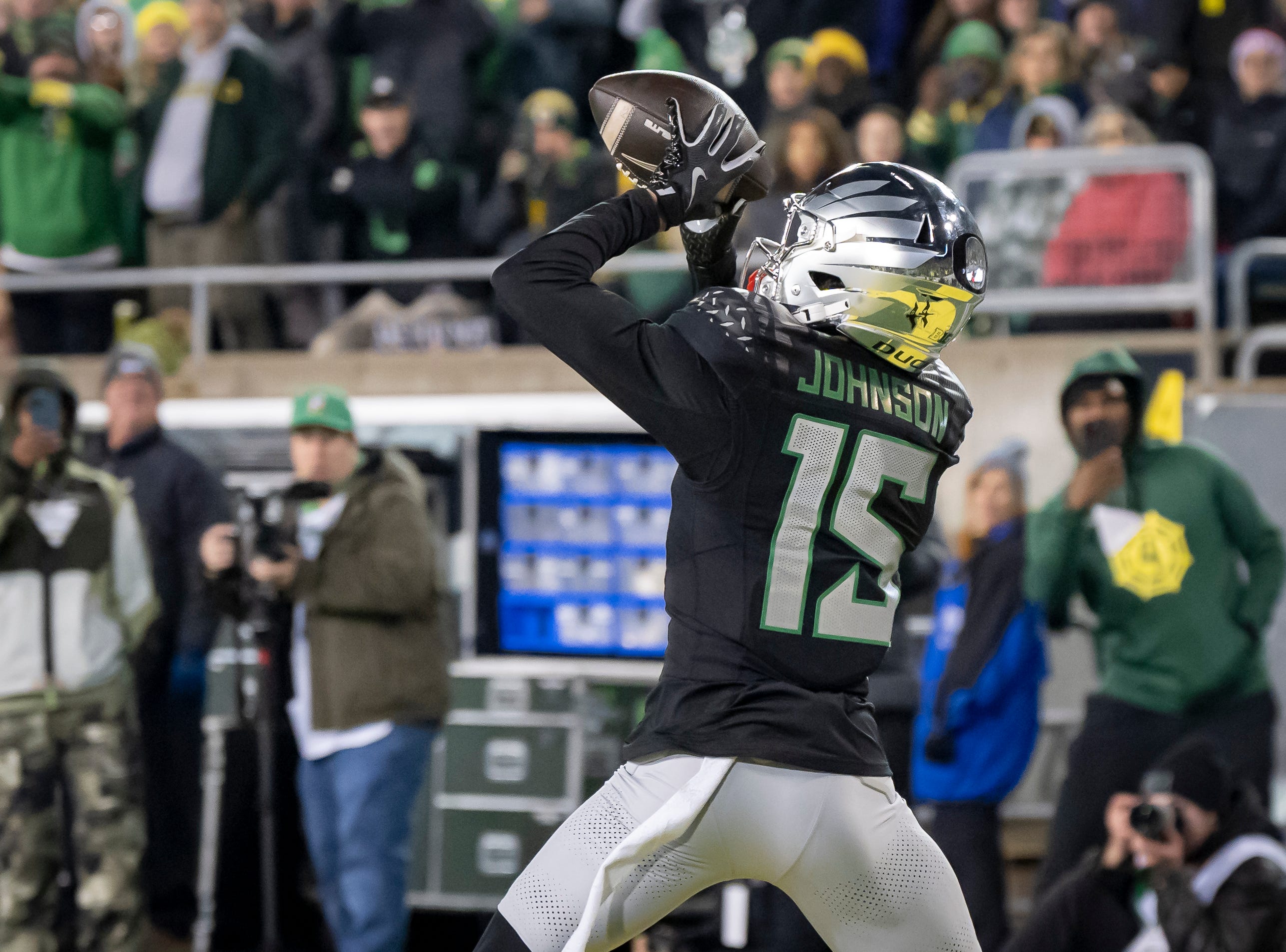 Oregon wide receiver Tez Johnson hauls in a touchdown pass