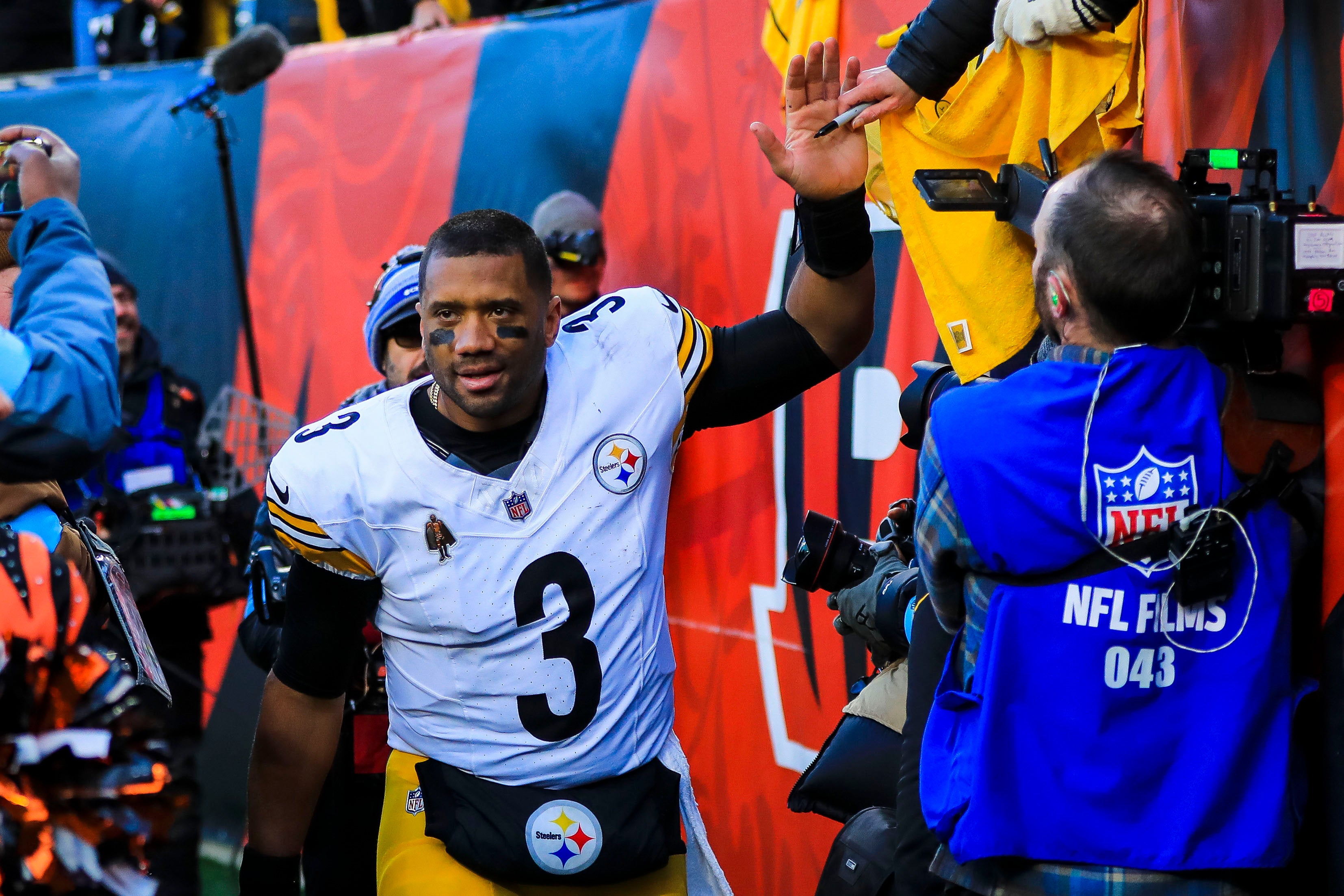Dec 1, 2024; Cincinnati, Ohio, USA; Pittsburgh Steelers quarterback Russell Wilson (3) high fives fans after the victory over the Cincinnati Bengals at Paycor Stadium.