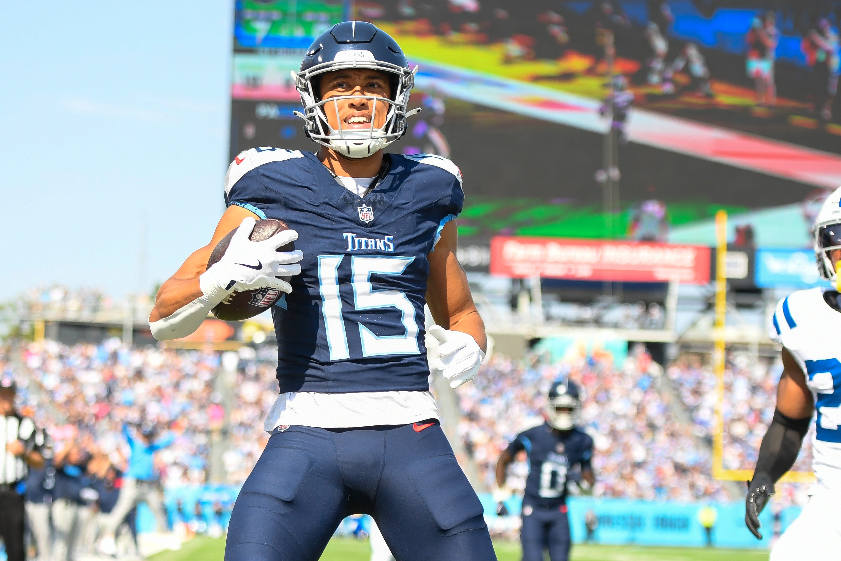 Oct 13, 2024; Nashville, Tennessee, USA; Tennessee Titans wide receiver Nick Westbrook-Ikhine (15) celebrates his touchdown against the Indianapolis Colts during the first half at Nissan Stadium. Mandatory Credit: Steve Roberts-Imagn Images