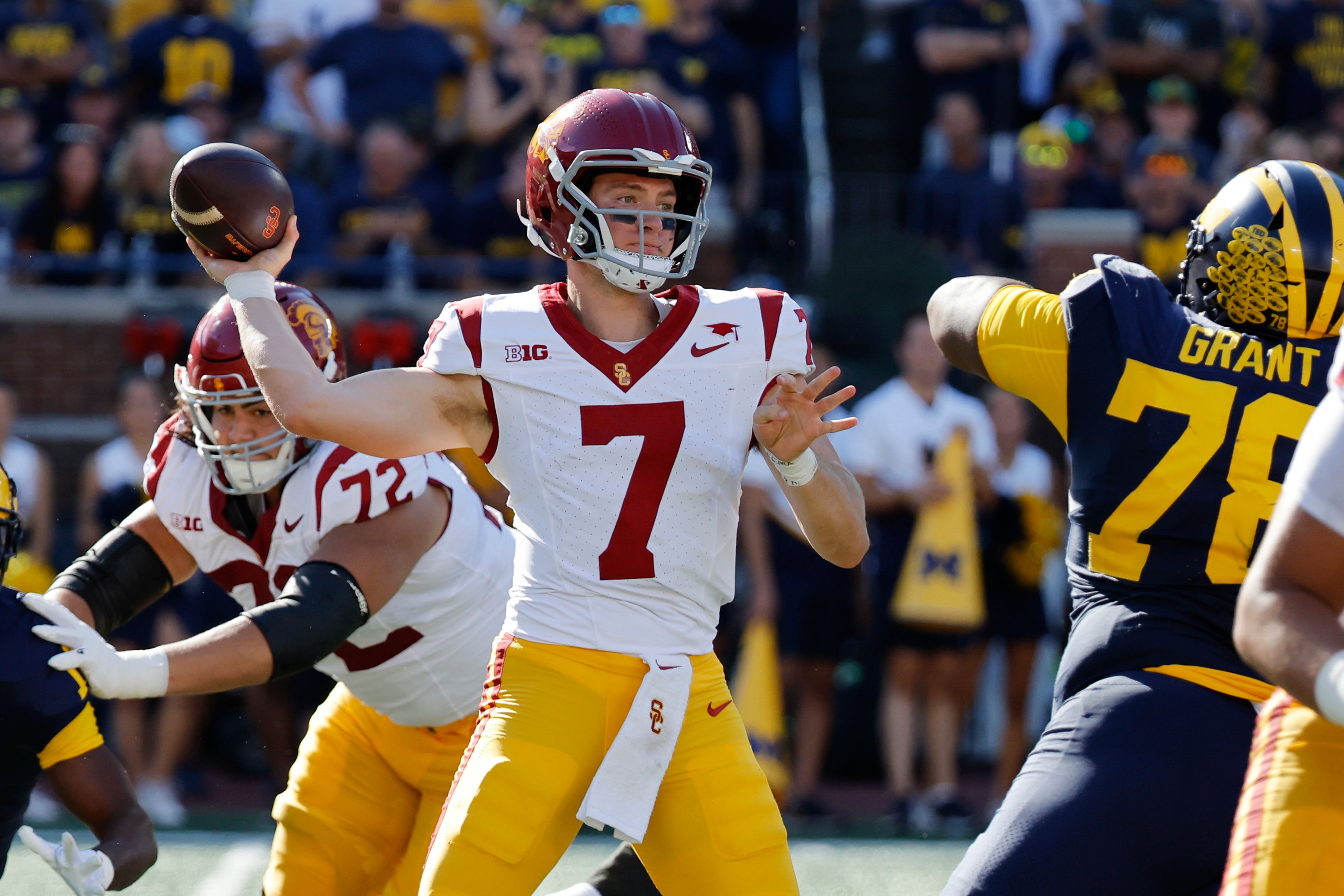 Sep 21, 2024; Ann Arbor, Michigan, USA; USC Trojans quarterback Miller Moss (7) passes in the first half against the Michigan Wolverines at Michigan Stadium.