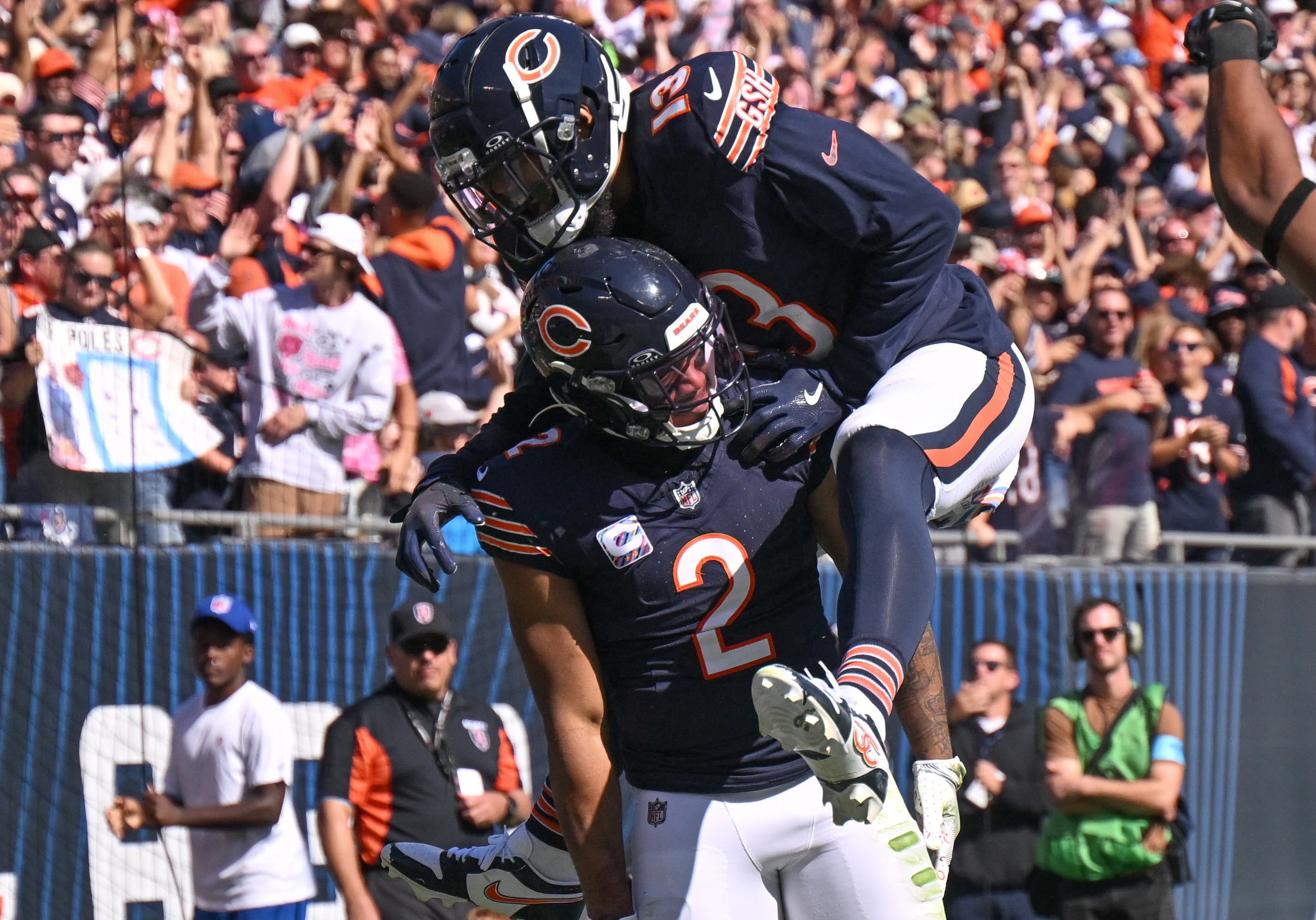 Oct 6, 2024; Chicago, Illinois, USA; Chicago Bears wide receiver DJ Moore (2) celebrates his receiving touchdown with wide receiver Keenan Allen (13) against the Carolina Panthers during the second quarter at Soldier Field.