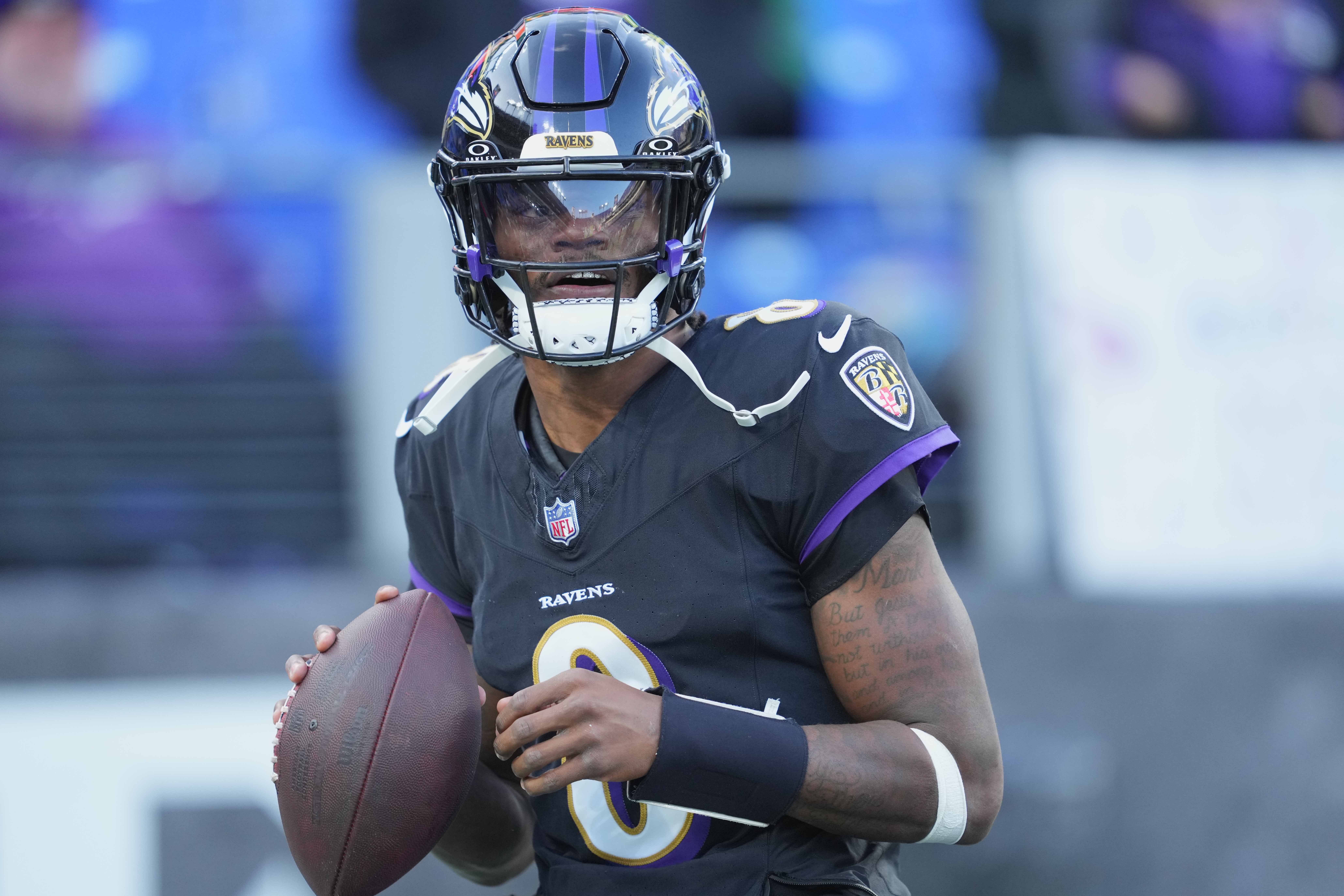 Dec 1, 2024; Baltimore, Maryland, USA; Baltimore Ravens quarterback Lamar Jackson (8) warms up prior the game against the Philadelphia Eagles at M&T Bank Stadium.