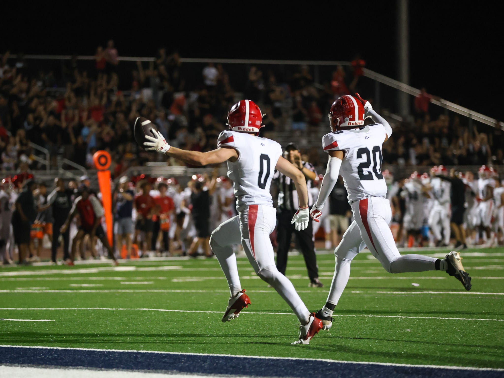Brophy Prep free safety James Pike (0) and Cree Thomas (20) celebrate after stopping Perry High School to end the game on Sept. 20, 2024, at Perry High School in Gilbert.