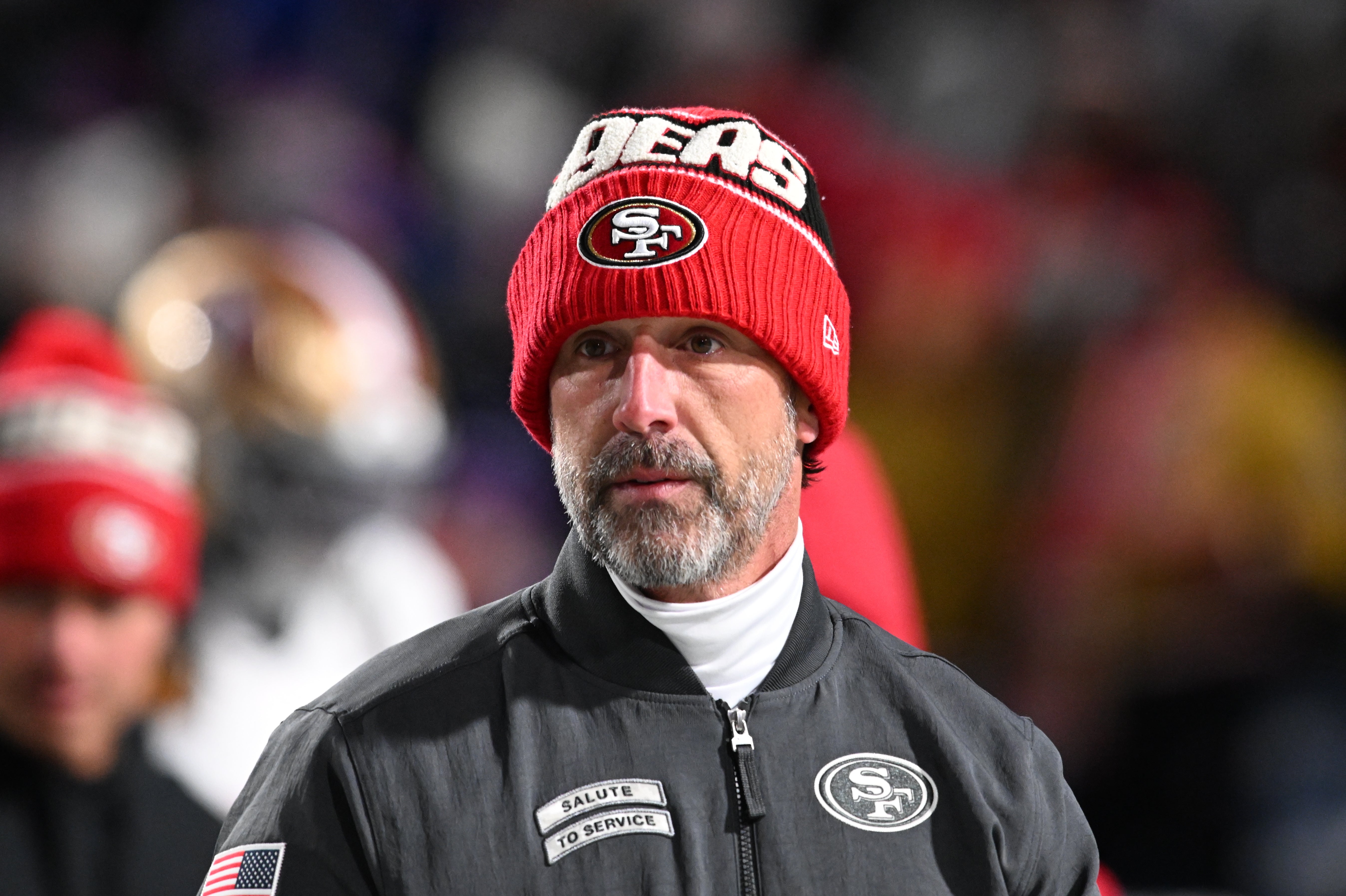 San Francisco 49ers head coach Kyle Shanahan on the field before a game against the Buffalo Bills at Highmark Stadium.