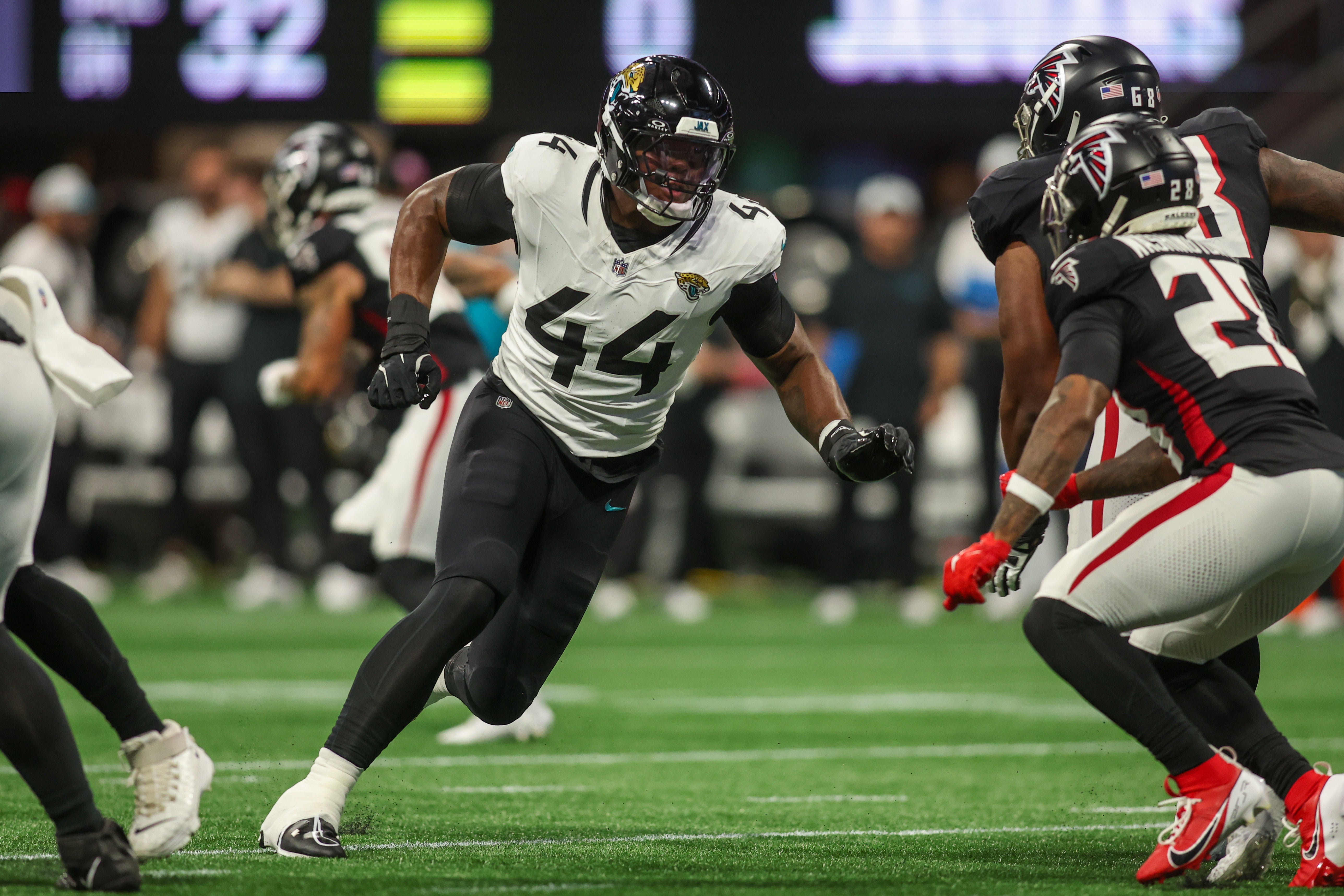 Aug 23, 2024; Atlanta, Georgia, USA; Jacksonville Jaguars defensive end Travon Walker (44) rushes the passer against the Atlanta Falcons in the first quarter at Mercedes-Benz Stadium.
