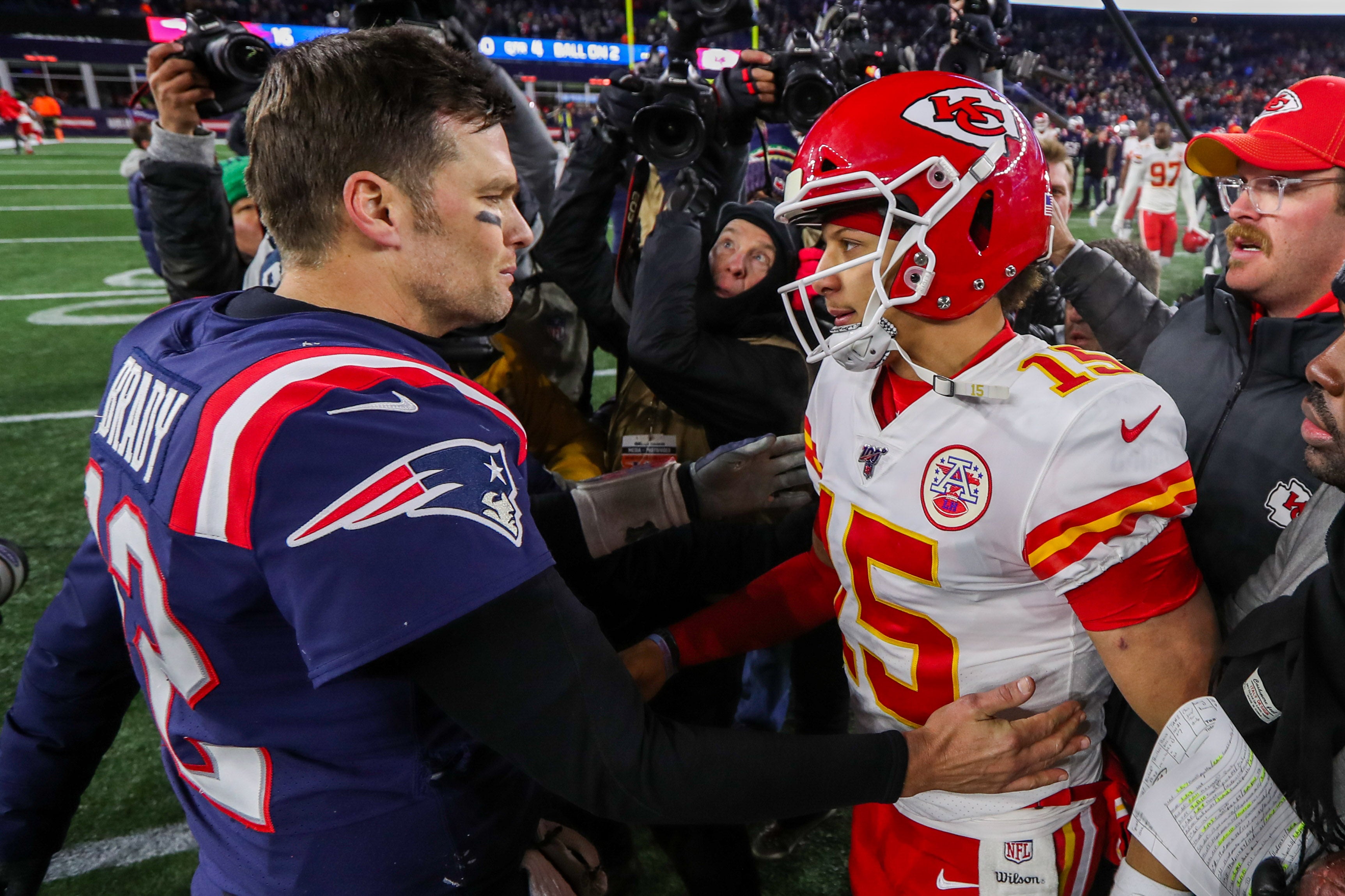Dec 8, 2019; Foxborough, MA, USA; New England Patriots quarterback Tom Brady (12) and Kansas City Chiefs quarterback Patrick Mahomes (15) after the game at Gillette Stadium.