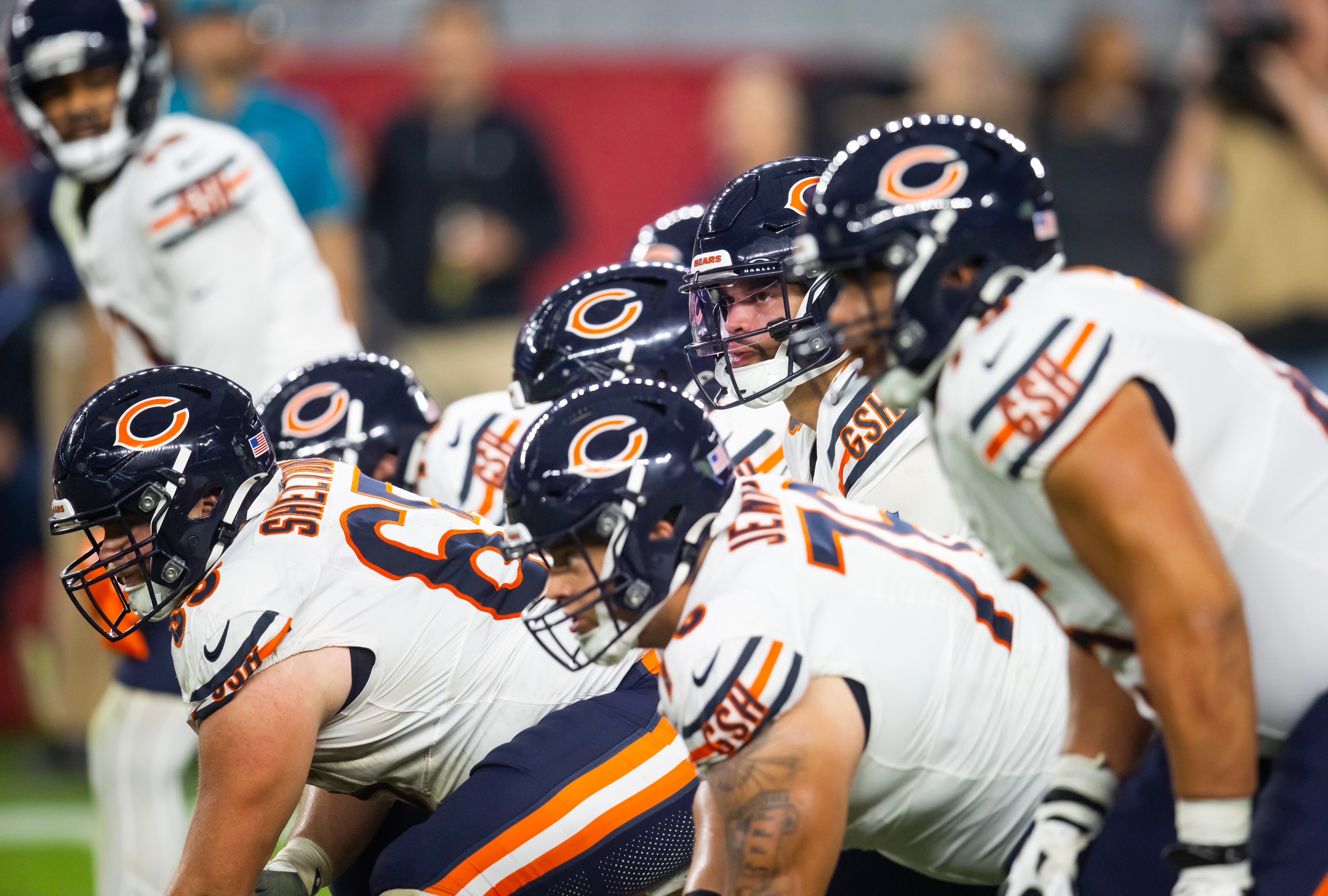 Nov 3, 2024; Glendale, Arizona, USA; Chicago Bears quarterback Caleb Williams (18) prepares to take the snap against the Arizona Cardinals at State Farm Stadium.