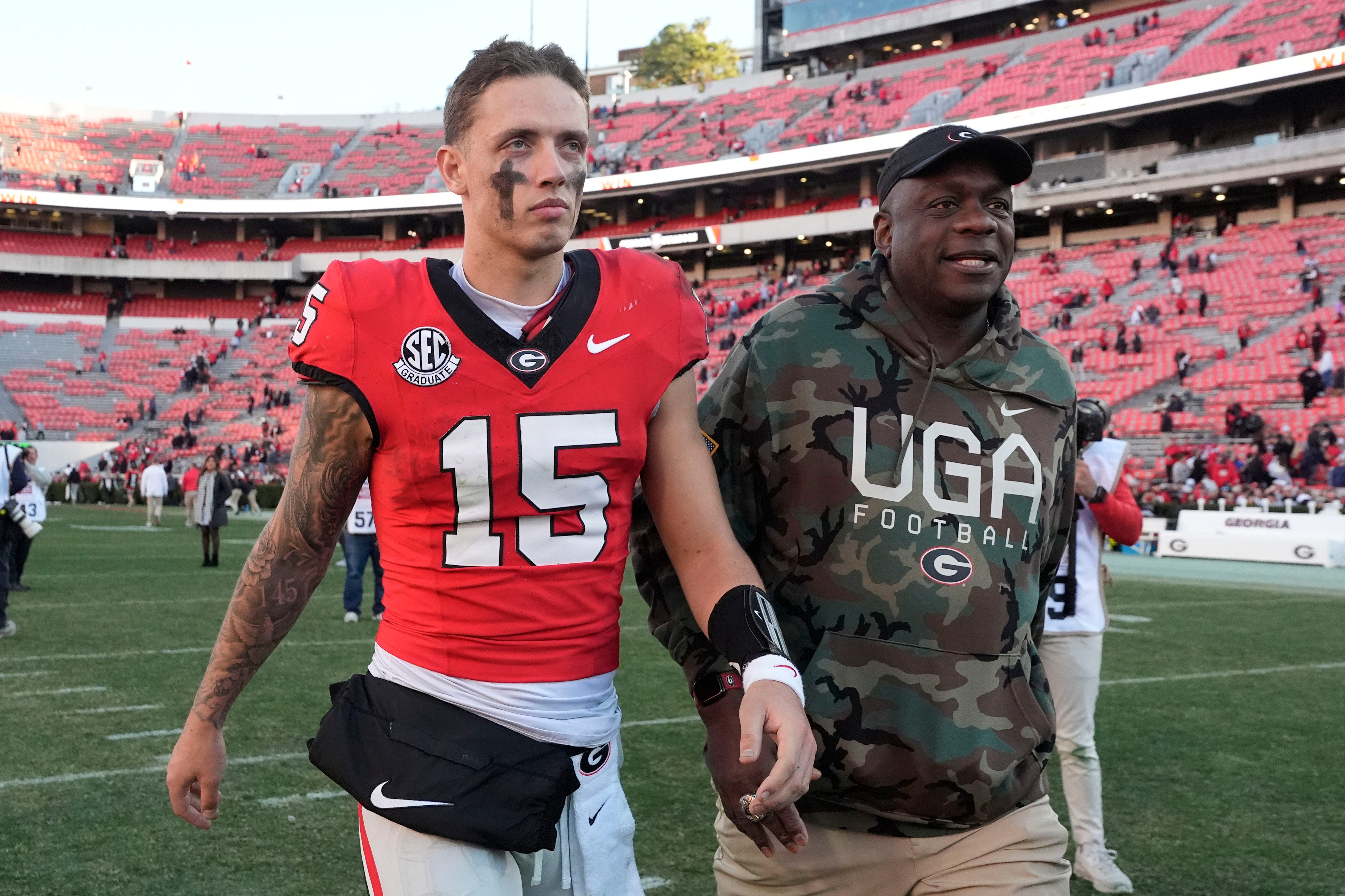 Georgia quarterback Carson Beck (15) leaves the field after a NCAA college football game against Massachusetts in Athens, Ga., on Saturday, Nov. 23, 2024. Georgia won 59-21.