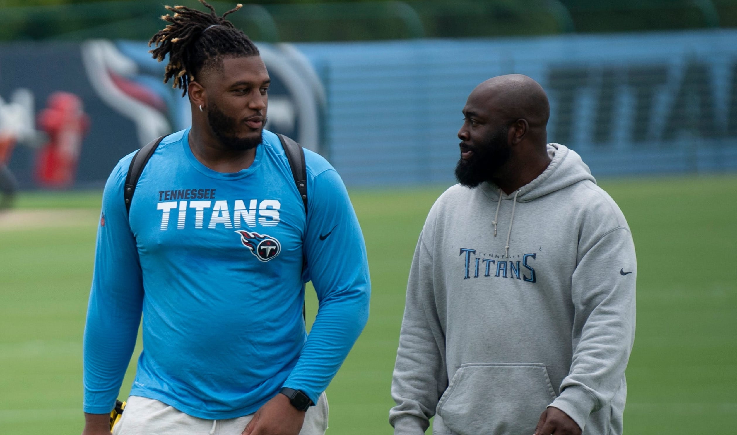 Tennessee Titans tackle JC Latham, left, walks and talks with General Manager Ran Carthon after practice on the first day of training camp at Ascension Saint Thomas Sports Park Wednesday, July 24, 202... Denny Simmons/The Tennessean-USA TODAY NETWORK
