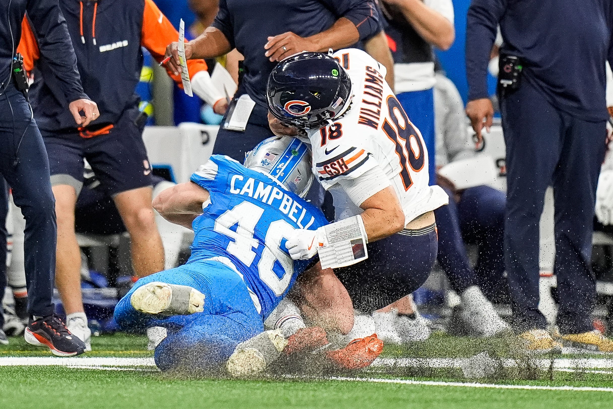 Detroit Lions linebacker Jack Campbell (46) tackles Chicago Bears quarterback Caleb Williams (18) during the second half at Ford Field in Detroit on Thursday, Nov. 28, 2024.