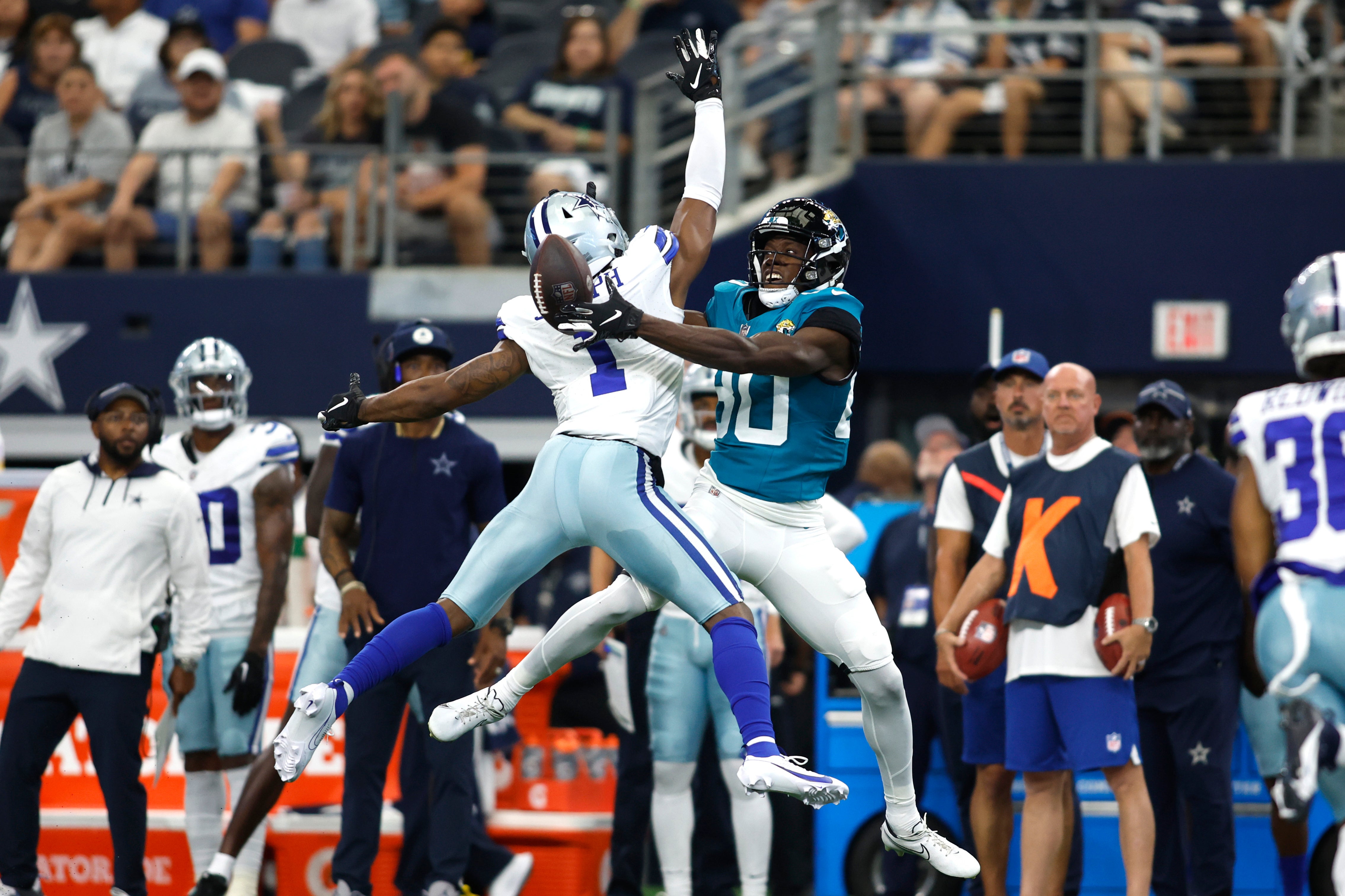 Aug 12, 2023; Arlington, Texas, USA; Jacksonville Jaguars wide receiver Kevin Austin Jr. (80) cannot catch a pass against Dallas Cowboys cornerback Kelvin Joseph (1) in the first quarter at AT&T Stadium.