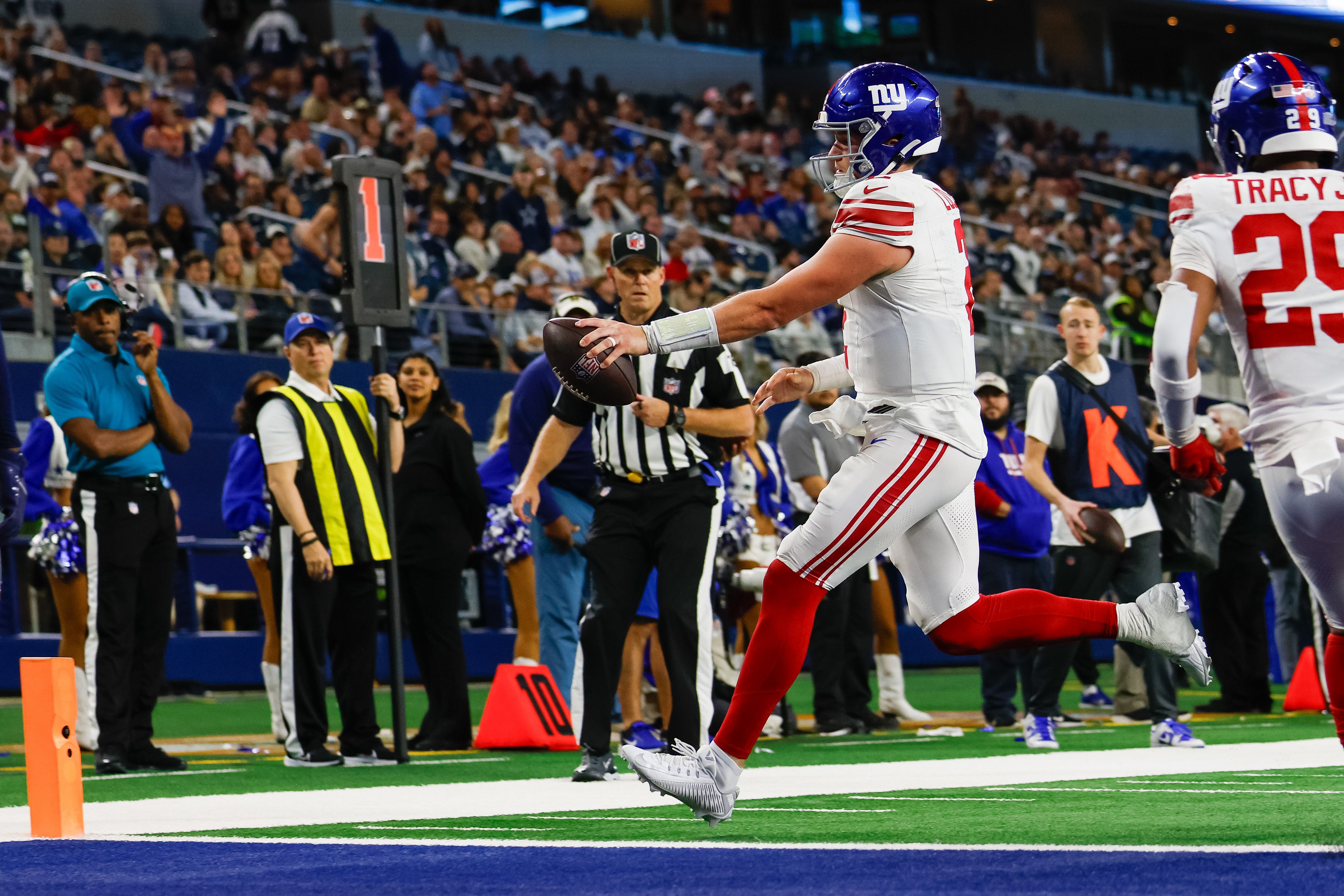 New York Giants quarterback Drew Lock (2) rushes for a touchdown during the fourth quarter against the Dallas Cowboys at AT&T Stadium.