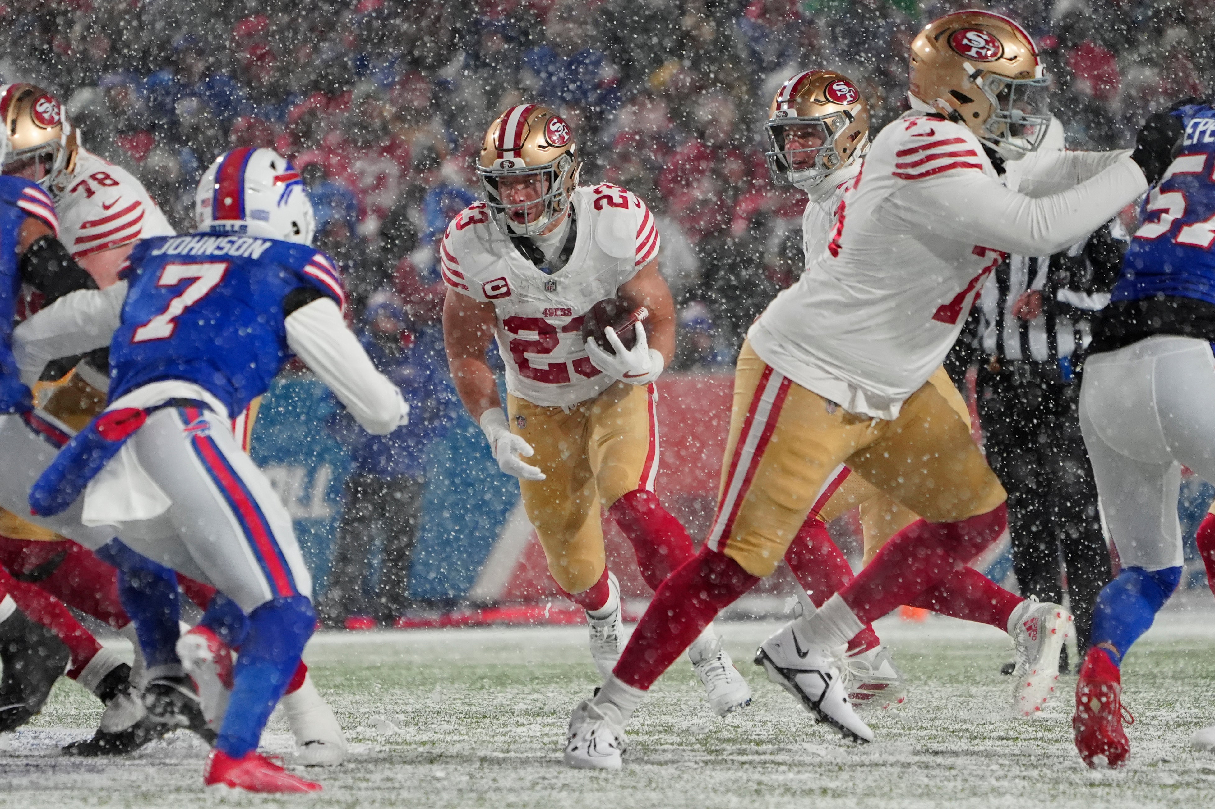 San Francisco 49ers running back Christian McCaffrey (23) runs with the ball against the Buffalo Bills during the first half at Highmark Stadium.