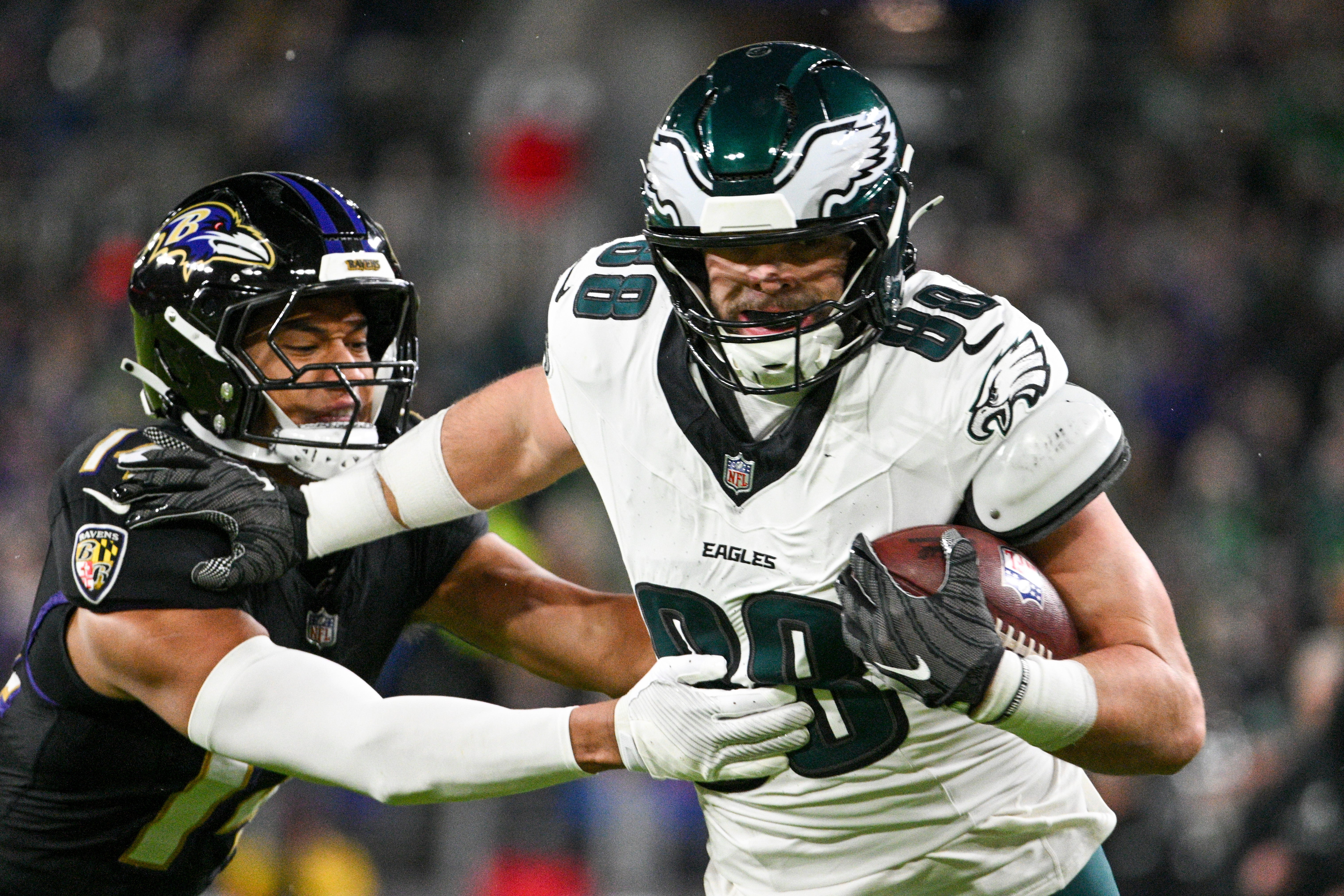 Philadelphia Eagles tight end Dallas Goedert (88) runs through Baltimore Ravens safety Kyle Hamilton (14) tackles attempt for a touchdown during the first half at M&T Bank Stadium.