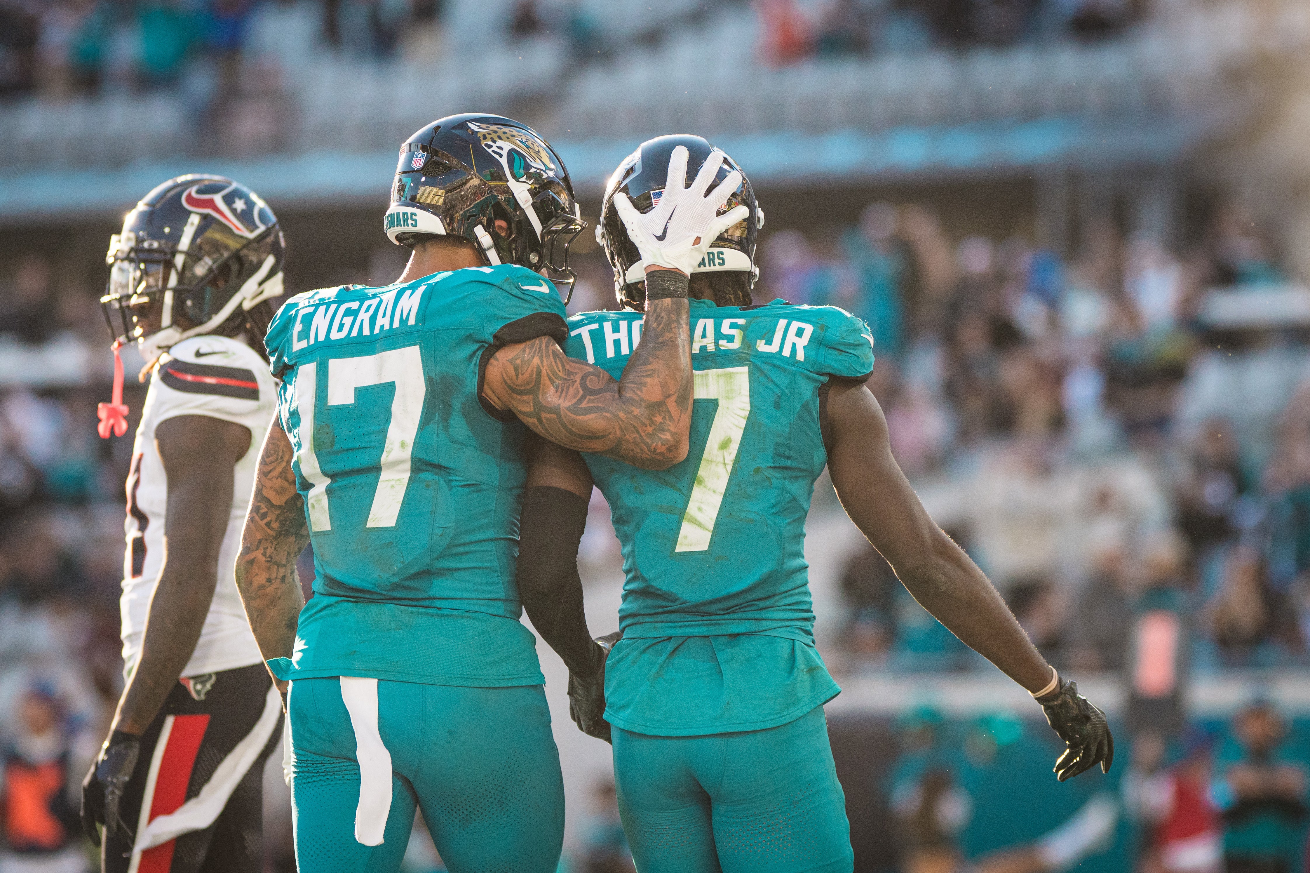 Dec 1, 2024; Jacksonville, Florida, USA; Jacksonville Jaguars tight end Evan Engram (17) and wide receiver Brian Thomas Jr (7) celebrate a touchdown against the Houston Texans in the fourth quarter at EverBank Stadium.
