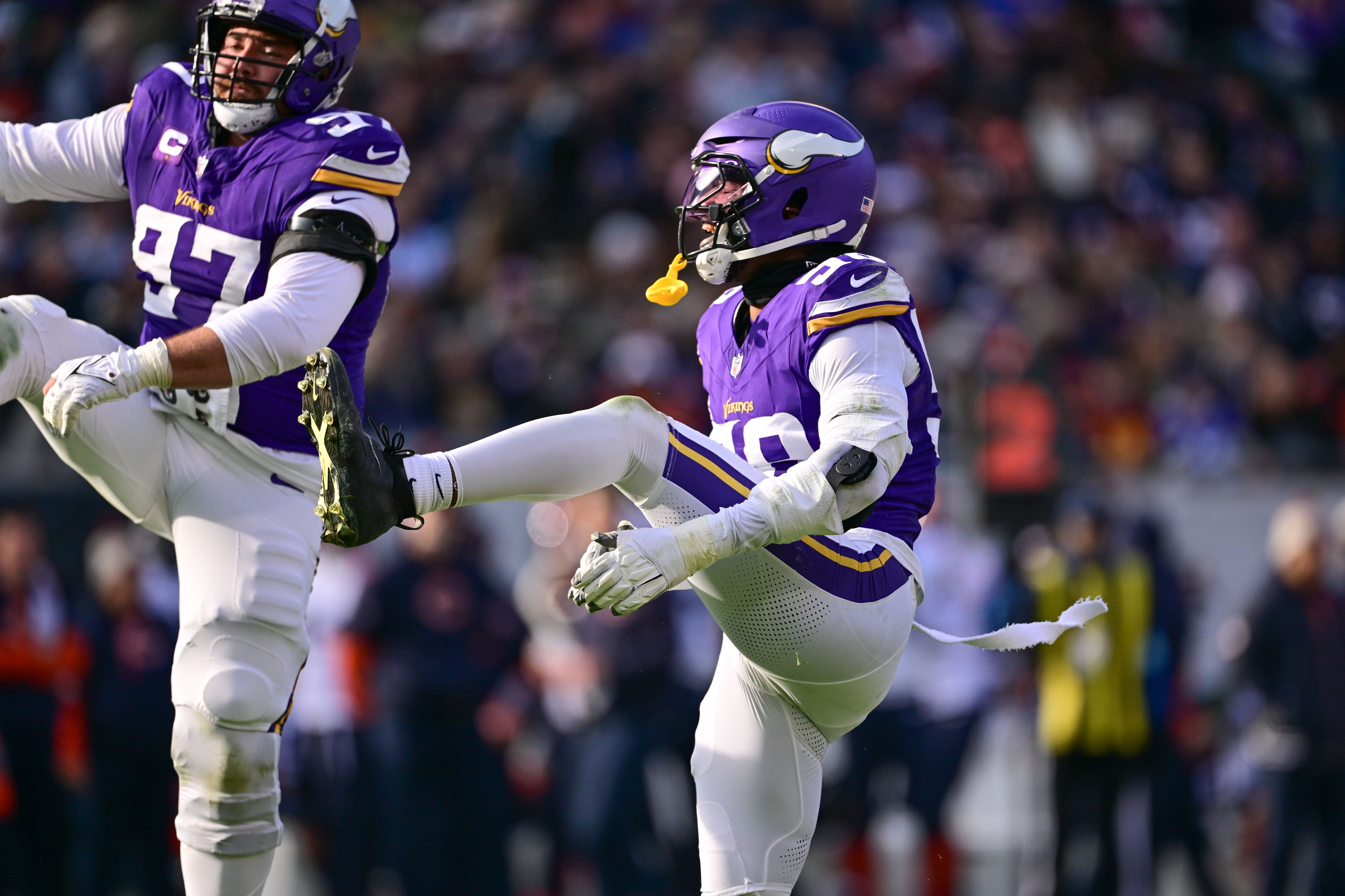 Nov 24, 2024; Chicago, Illinois, USA; Minnesota Vikings linebacker Jonathan Greenard (58) celebrates his sack against the Chicago Bears during the second quarter at Soldier Field.