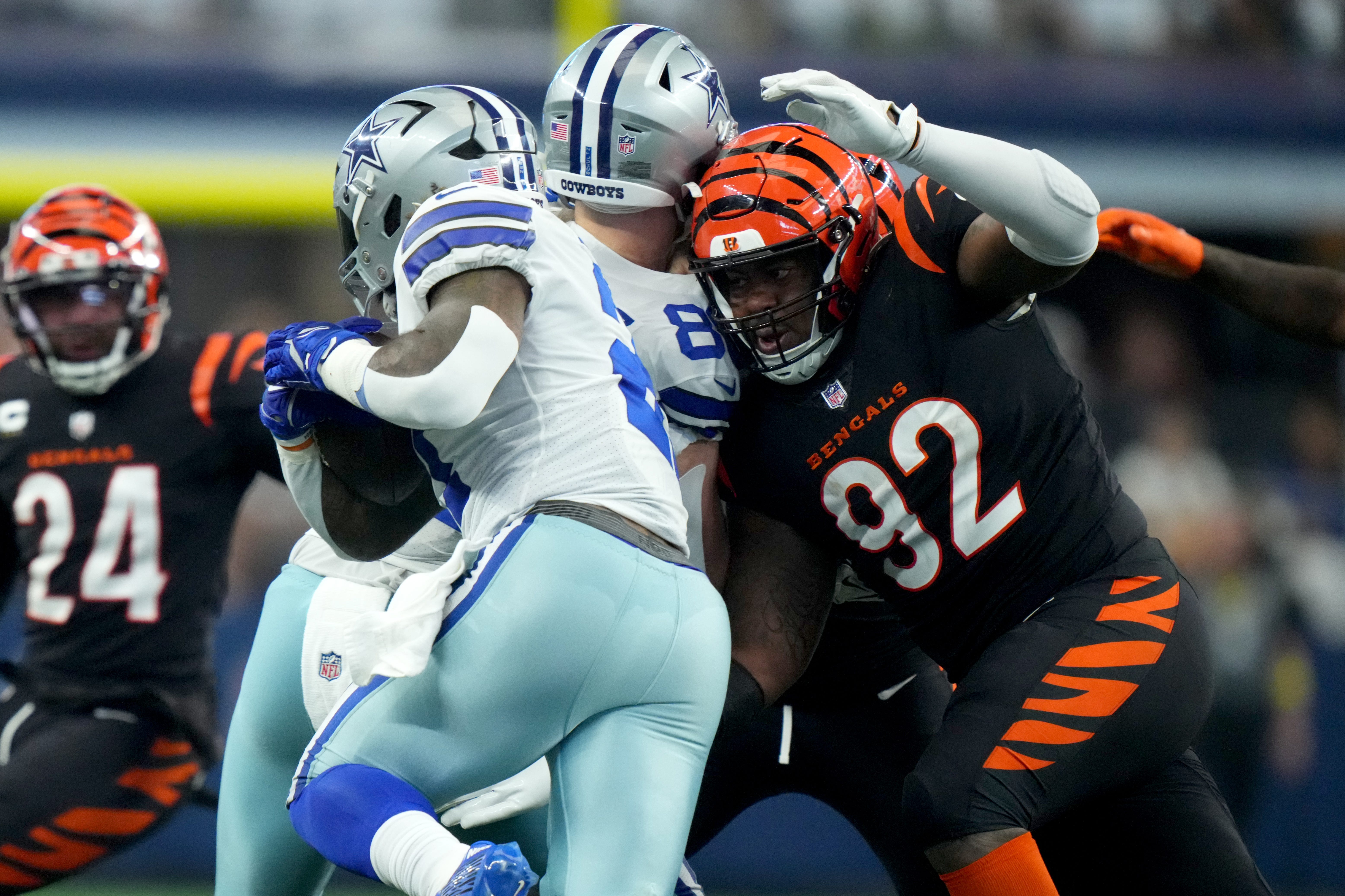 Cincinnati Bengals defensive tackle BJ Hill (92) tackled Dallas Cowboys running back Ezekiel Elliott (21) in the third quarter of an NFL Week 2 game, Sunday, Sept. 18, 2022, at AT&T Stadium in Arlington, Texas. The Dallas Cowboys won, 20-17. Nfl Cincinnati Bengals At Dallas Cowboys Sept 18 2454  