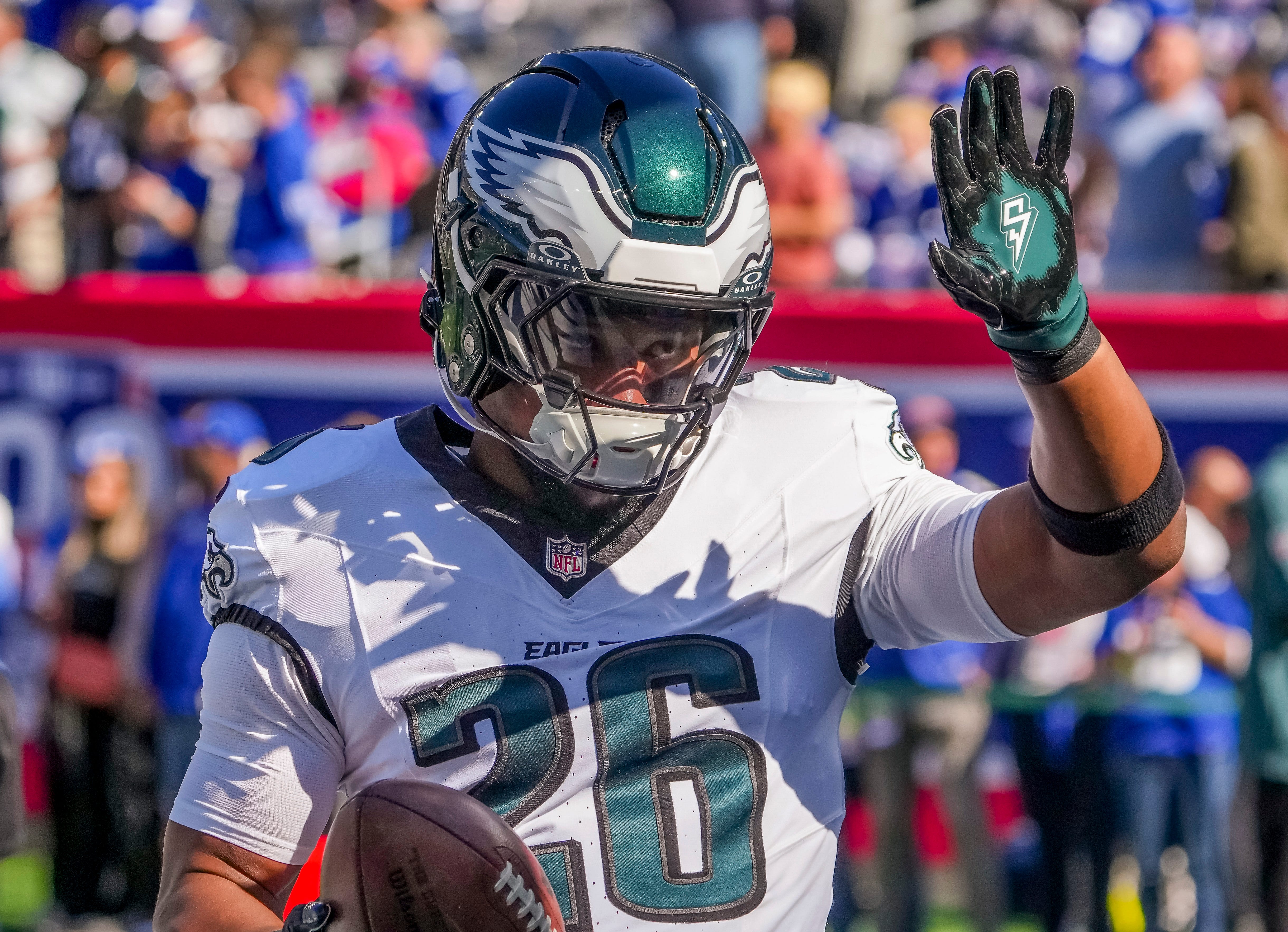 Philadelphia Eagles running back (and former NY Giants back) Saquon Barkley (26) greets fans at MetLife Stadium.