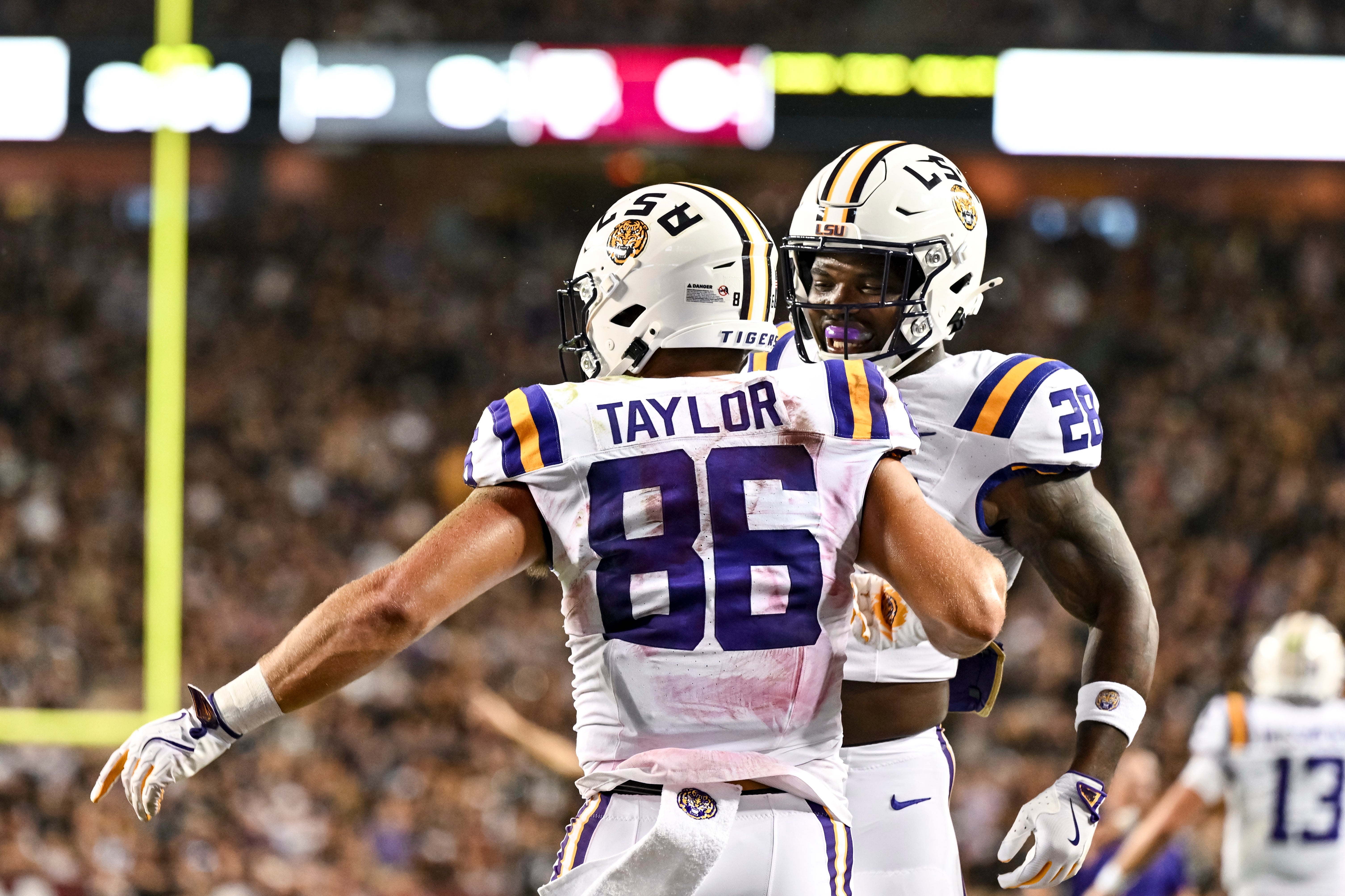 Oct 26, 2024; College Station, Texas, USA; LSU Tigers tight end Mason Taylor (86) celebrates with running back Kaleb Jackson (28) during the first quarter against the Texas A&M Aggies at Kyle Field.
