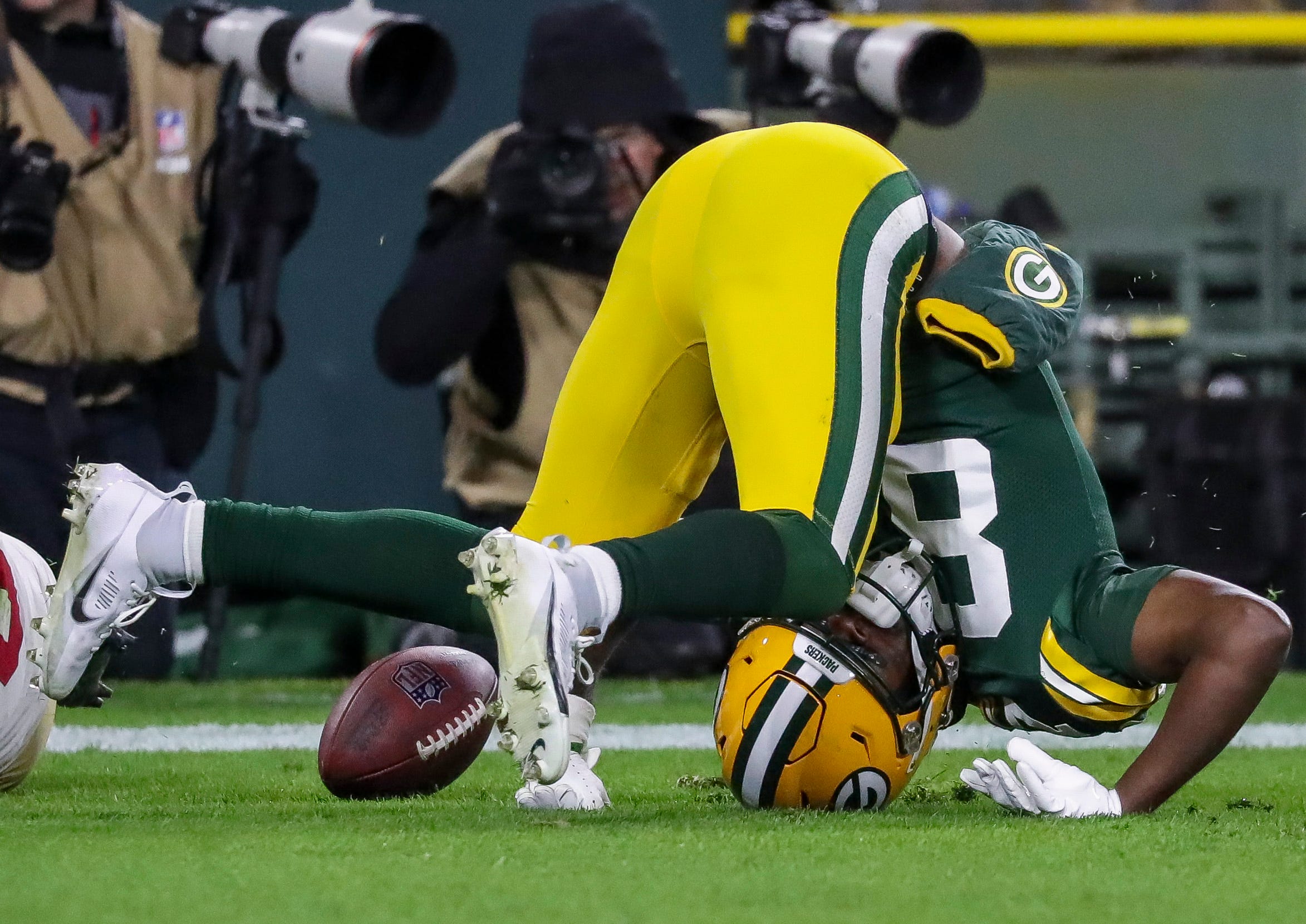 Green Bay Packers wide receiver Romeo Doubs (87) lands awkwardly after trying to catch a would-be touchdown pass against the San Francisco 49ers on Sunday, November 24, 2024, at Lambeau Field in Green Bay, Wis. The Packers won the game, 38-10.