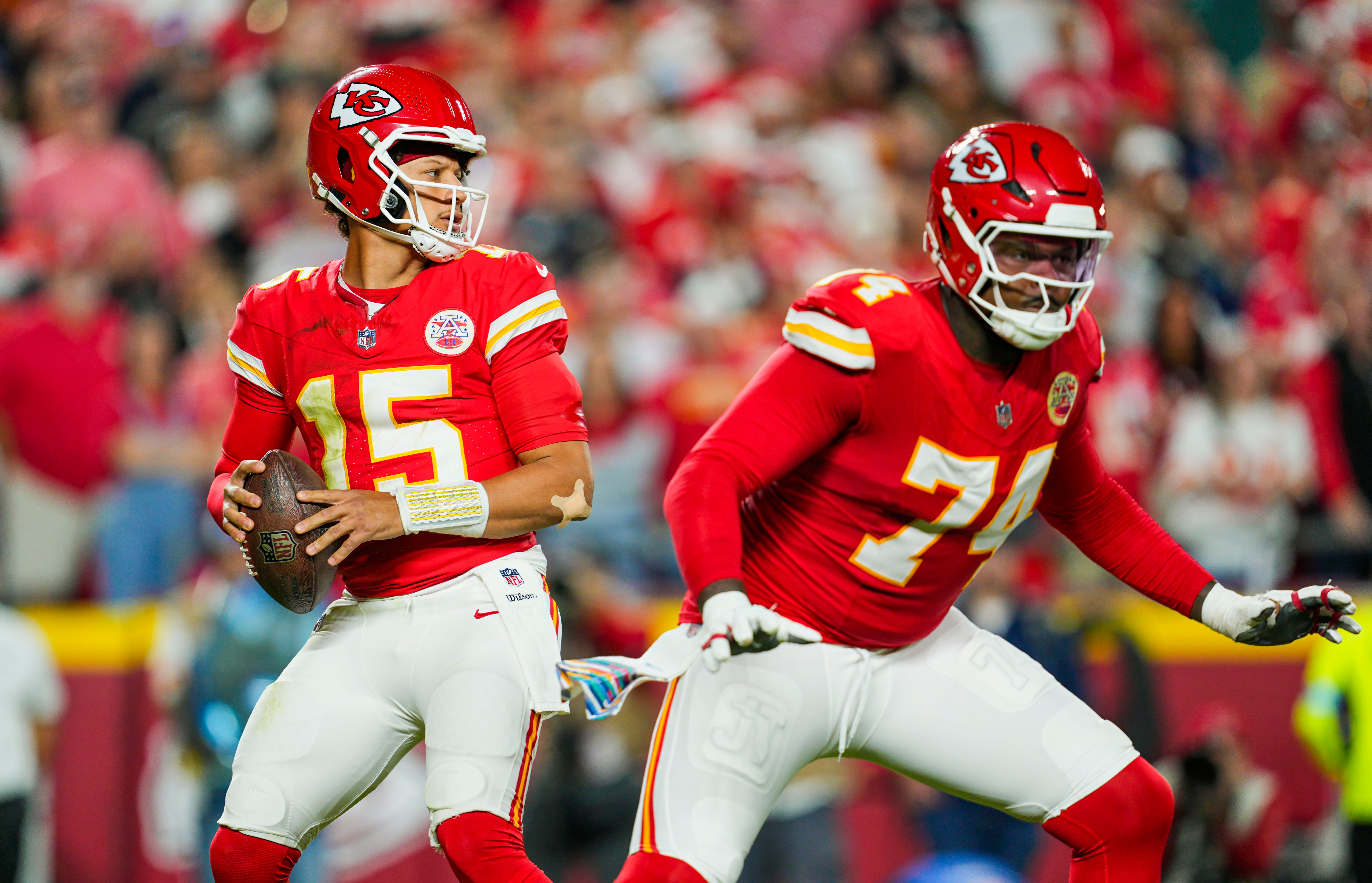 Oct 7, 2024; Kansas City, Missouri, USA; Kansas City Chiefs quarterback Patrick Mahomes (15) drops back to pass as offensive tackle Jawaan Taylor (74) gets ready to block during the first half against the New Orleans Saints at GEHA Field at Arrowhead Stadium.