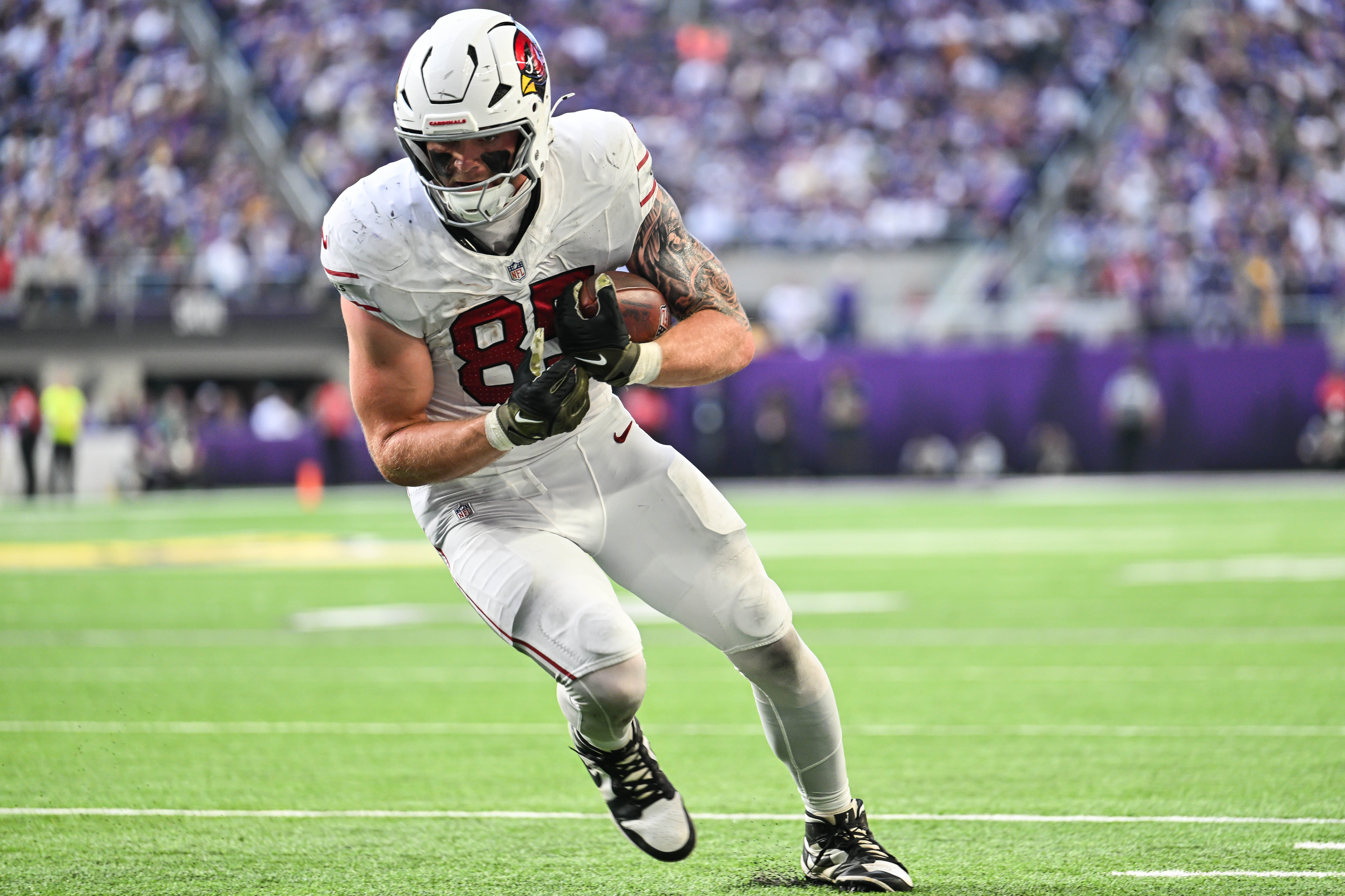 Cardinals tight end Trey McBride (85) gets yards after the catch against the Minnesota Vikings