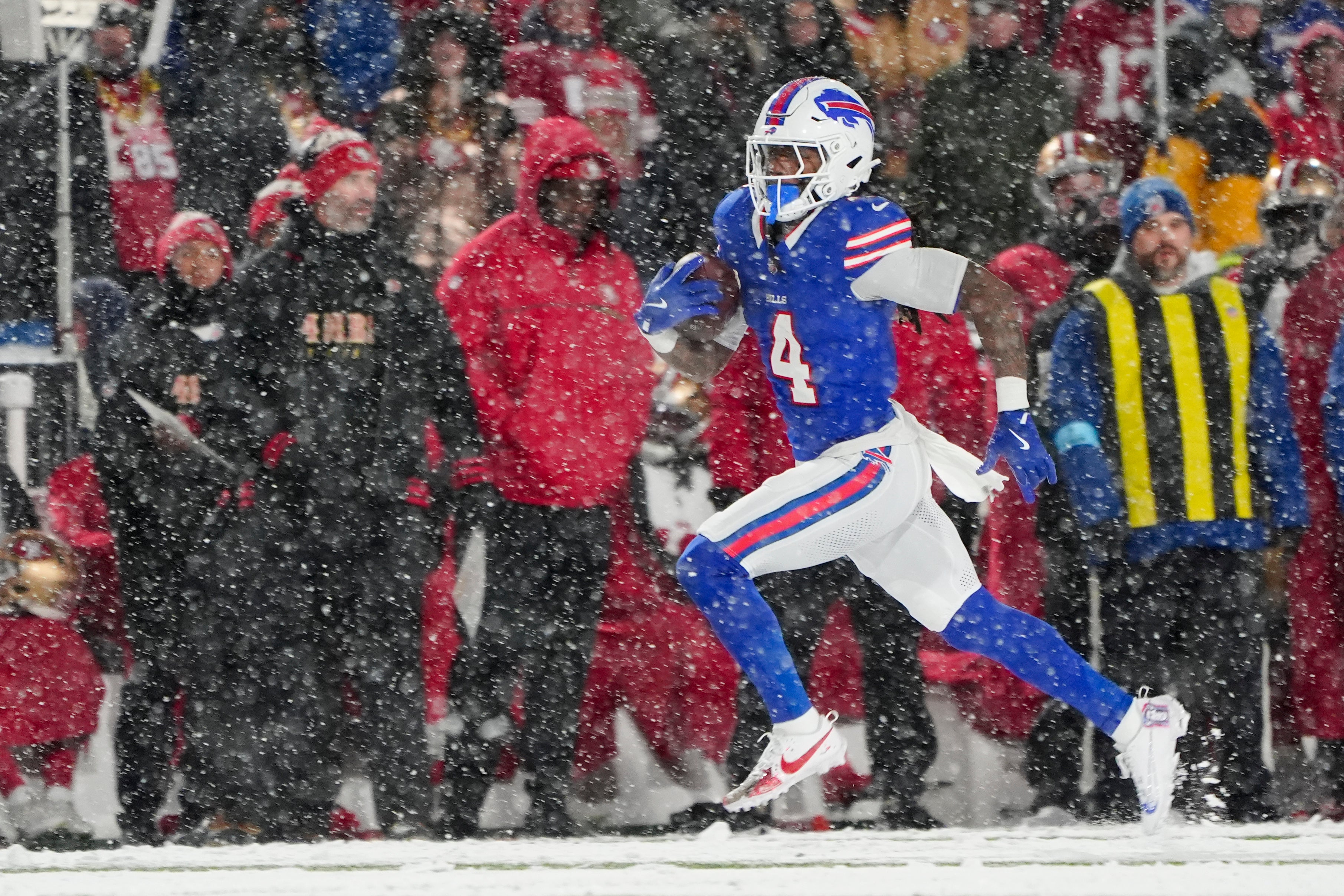 Bills running back James Cook (4) runs with the ball for a touchdown against the 49ers