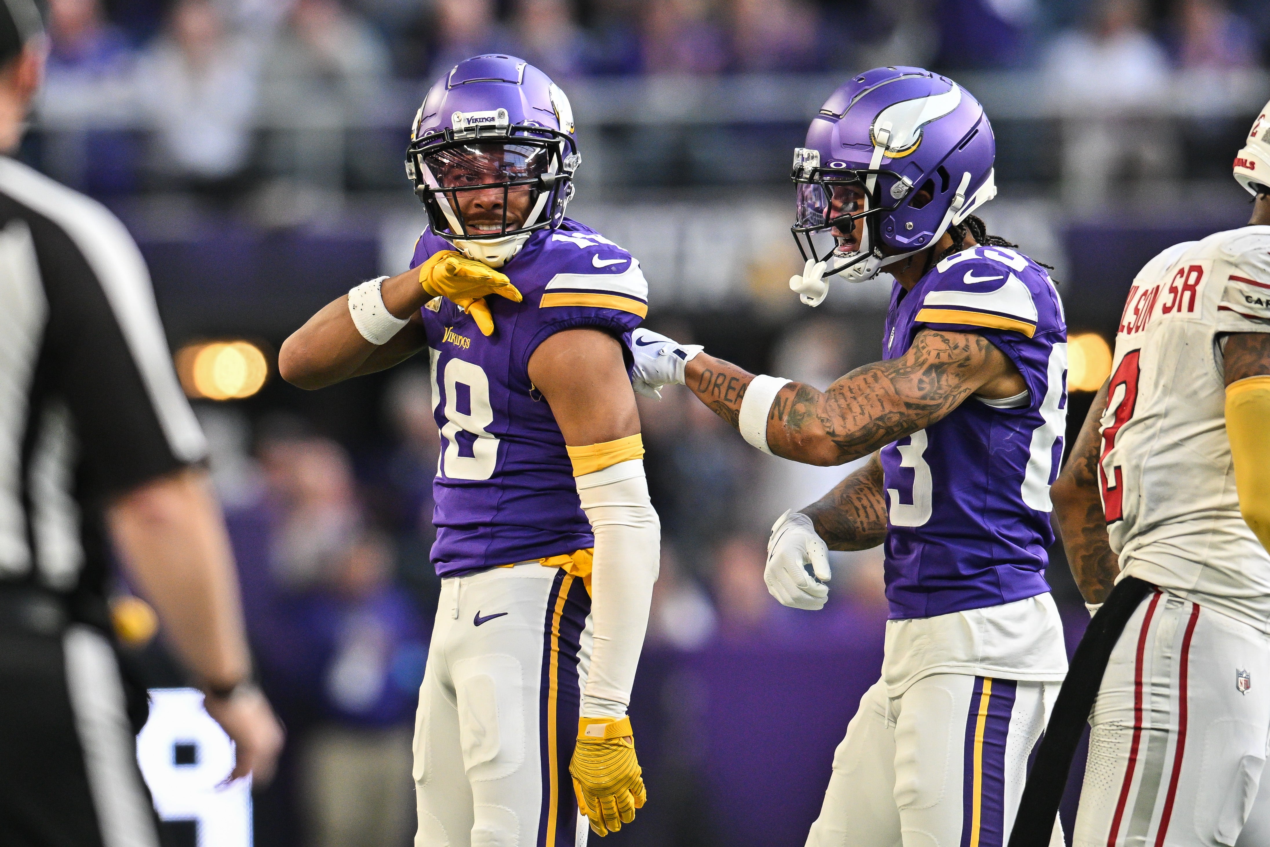 Dec 1, 2024; Minneapolis, Minnesota, USA; Minnesota Vikings wide receiver Justin Jefferson (18) reacts with wide receiver Jalen Nailor (83) during the fourth quarter against the Arizona Cardinals at U.S. Bank Stadium.