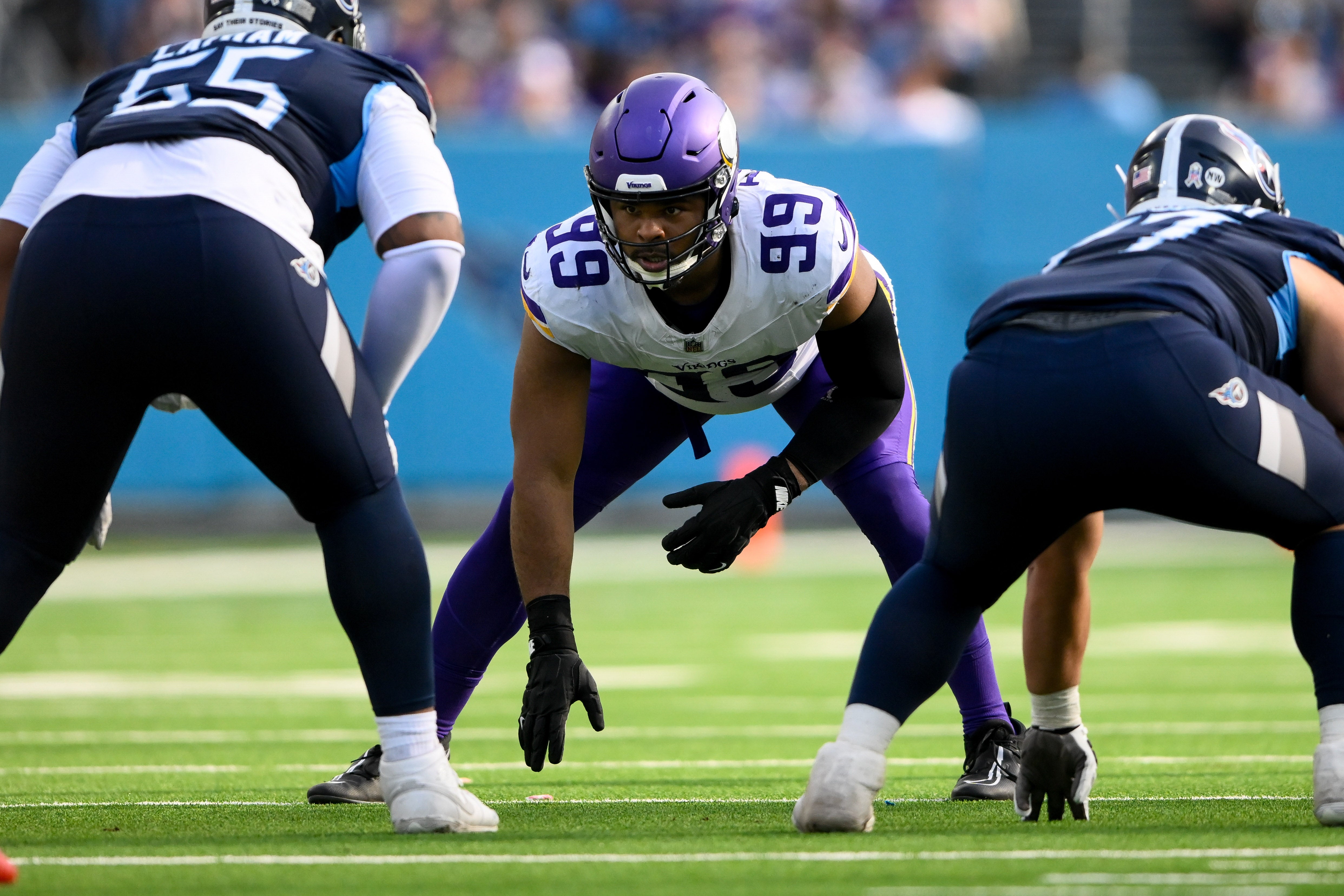 Nov 17, 2024; Nashville, Tennessee, USA; Minnesota Vikings defensive tackle Jerry Tillery (99) looks up at Tennessee Titans offensive tackle JC Latham (55) just before the ball is snapped during the second half during the first half at Nissan Stadium.